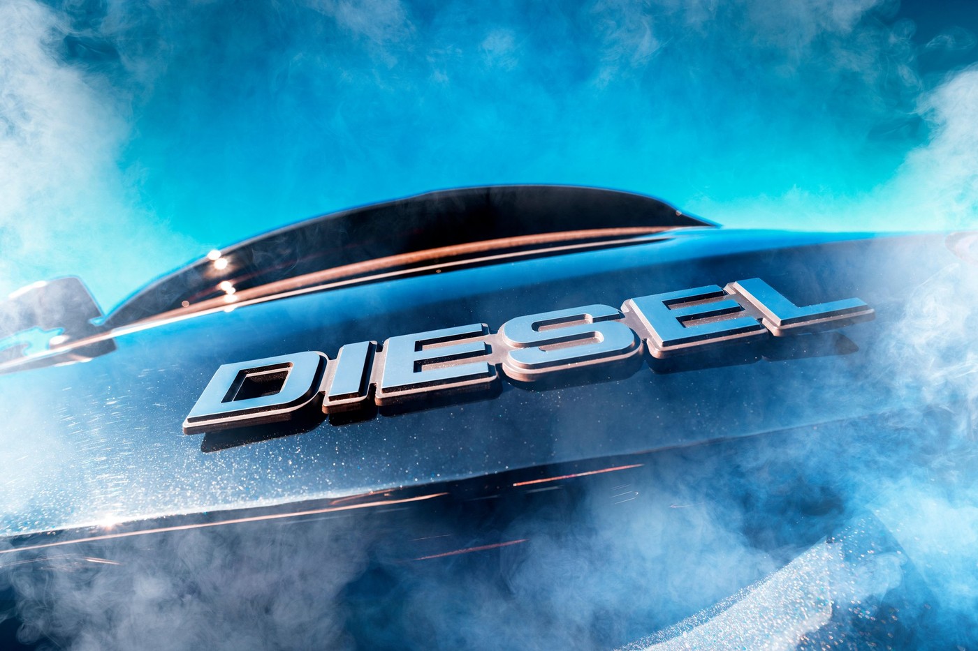 Diesel signs on a car and exhaust gases, symbolic photo diesel scandal, Dieselzeichen auf einem Auto und Abgase, Symbolfoto Dieselskandal