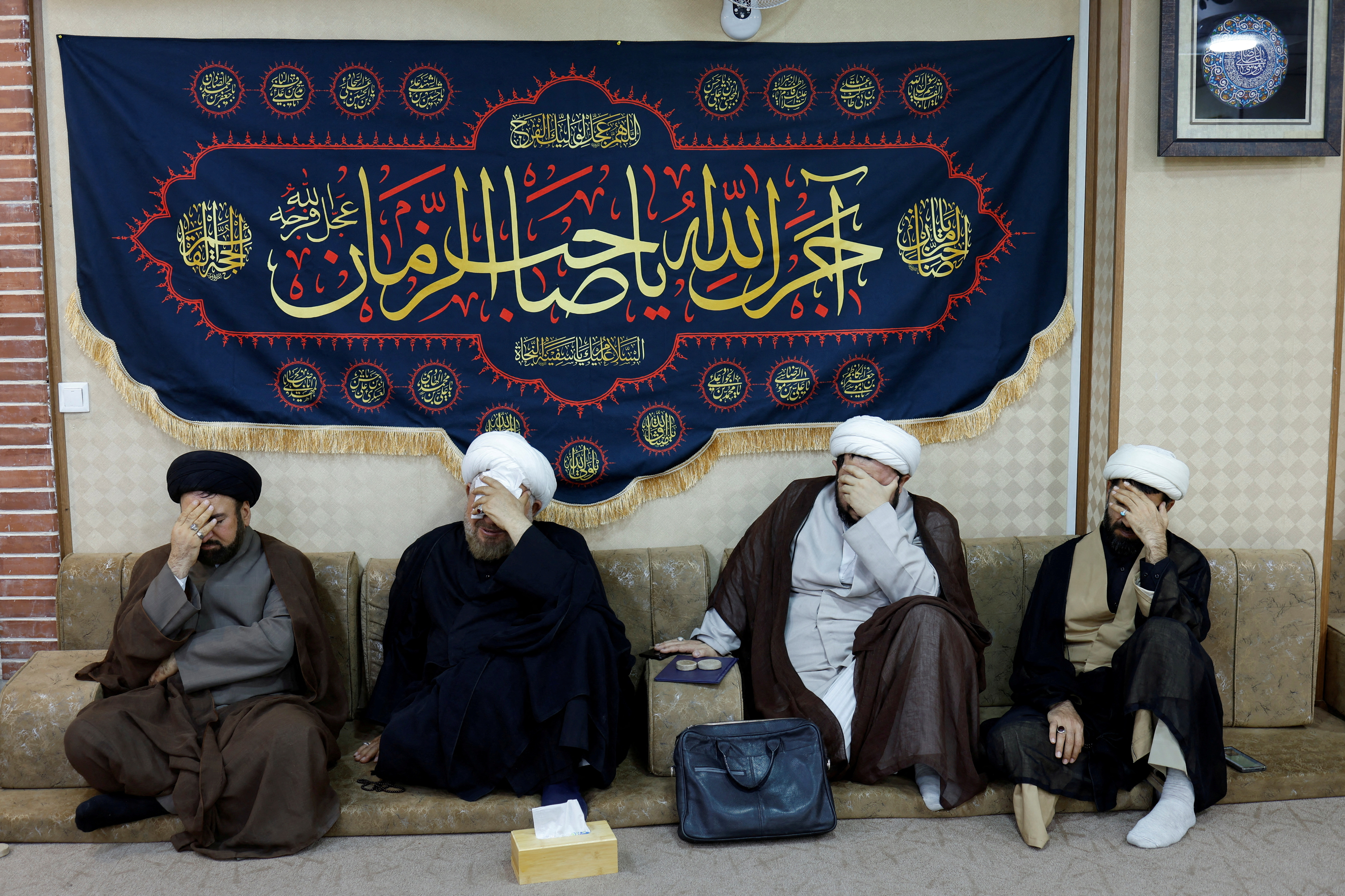 Religious clerics offer condolences over the deaths of Iran's President Ebrahim Raisi and others, at the representative office of Iran's Supreme Leader Ayatollah Ali Khamenei, in Najaf