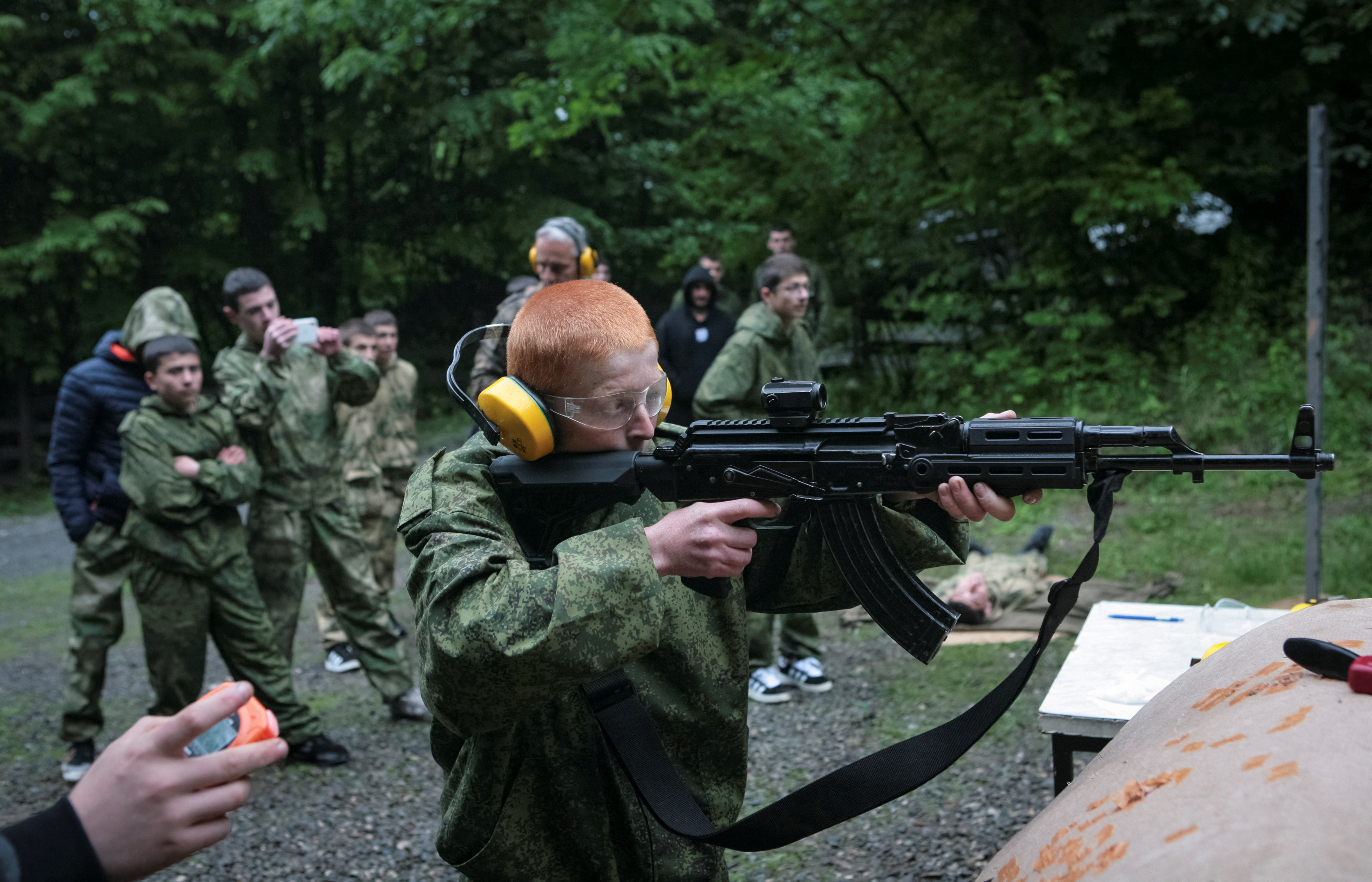 Pupils fire weapons and practise first aid at a range, in Vladikavkaz