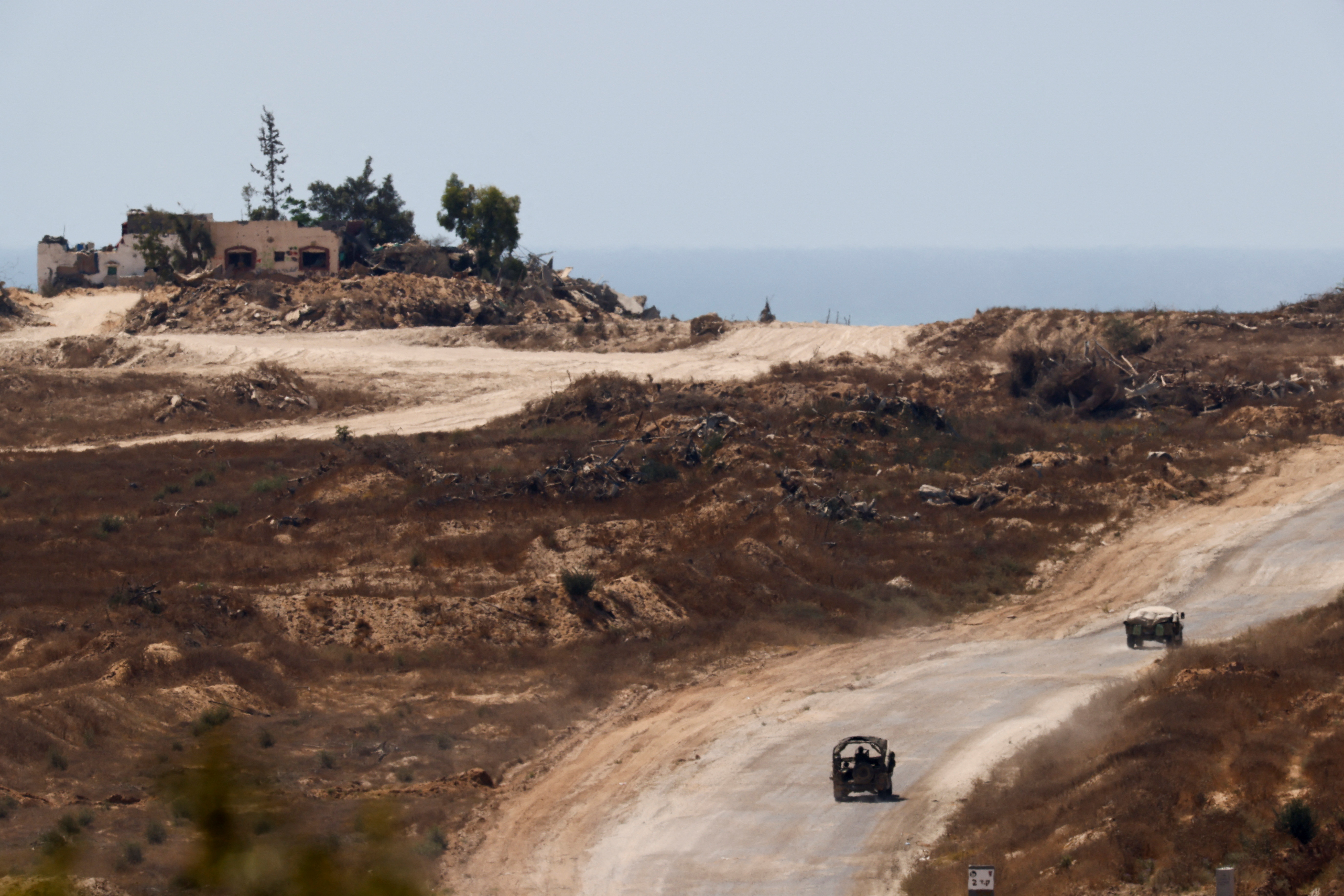 Israeli military vehicles maneuver inside the Gaza Strip