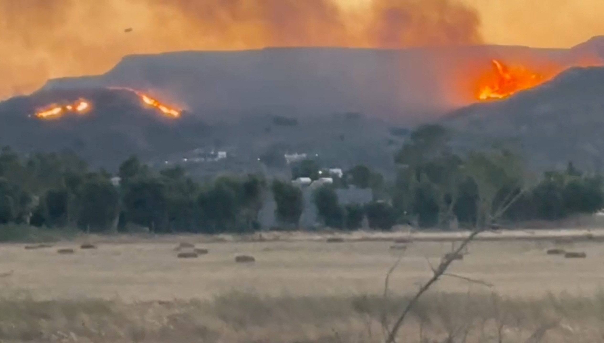 A general view of fire around the island of Kos