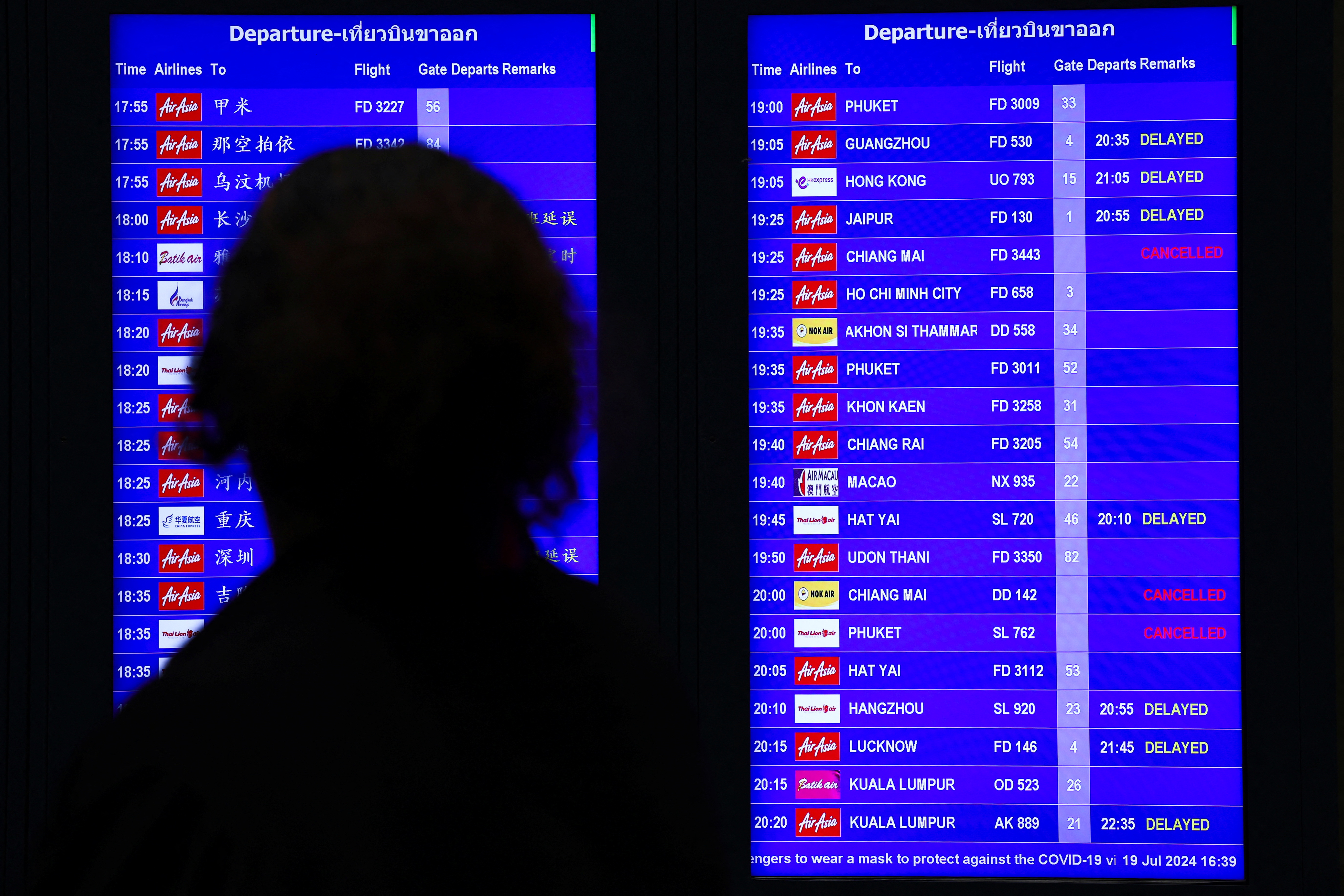 Don Mueang International Airport Terminal 1 amid system outages disrupting the airline's operations in Bangkok