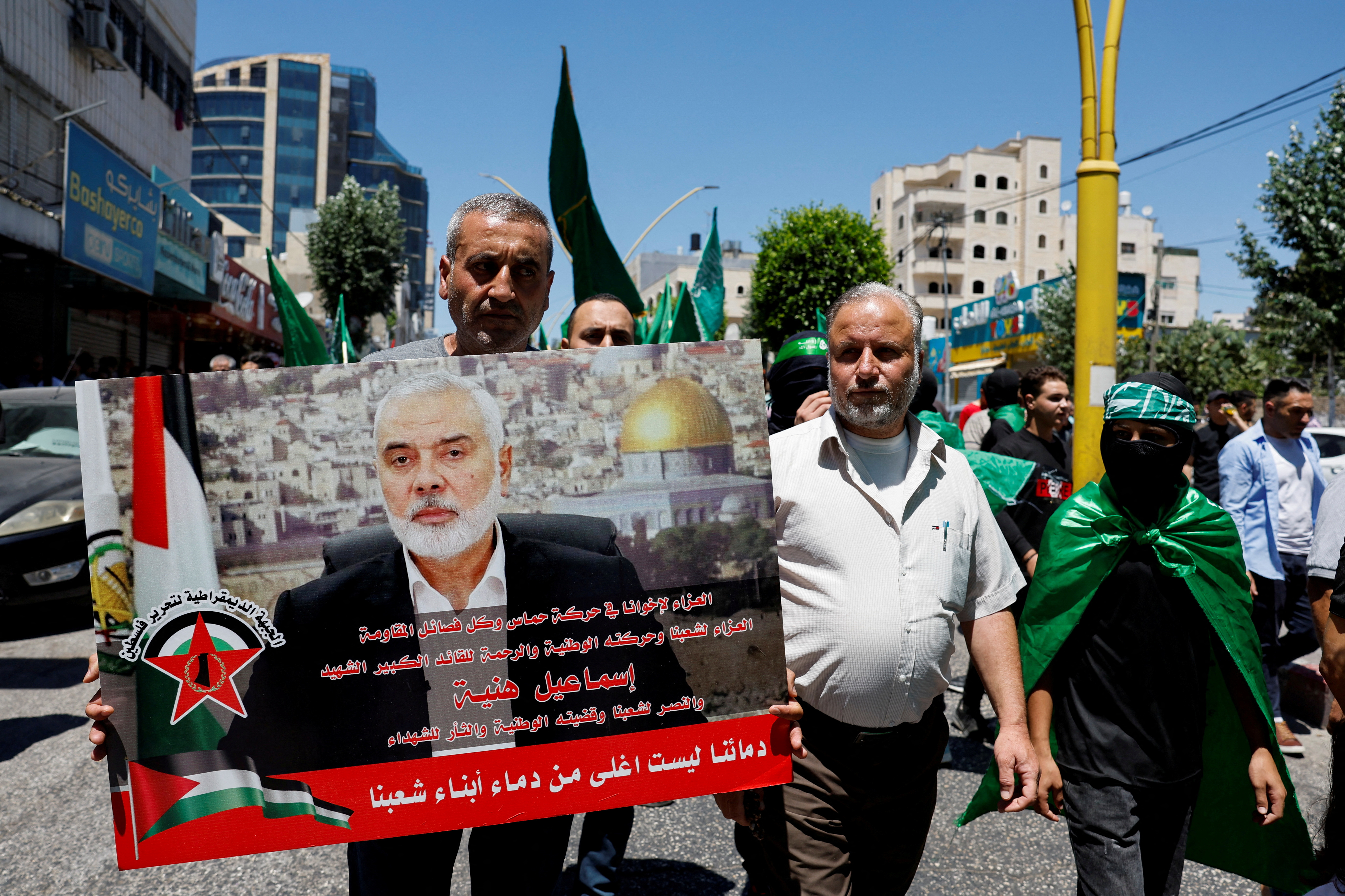 Palestinians protest after the assassination of Hamas leader Ismail Haniyeh in Iran, in Hebron