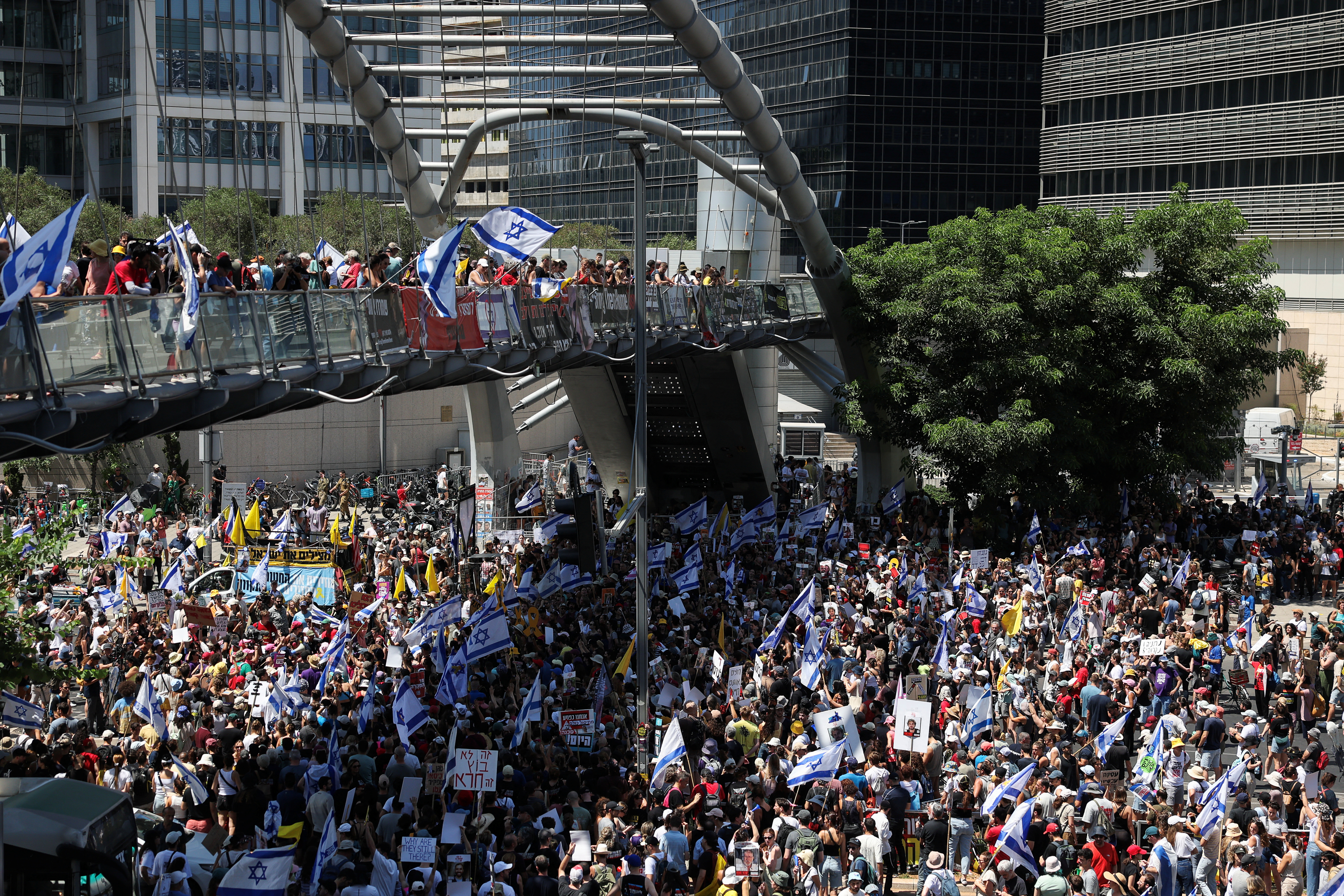 Protesters rally against the government and to show support for the hostages who were kidnapped during the deadly October 7 attack, in Tel Aviv