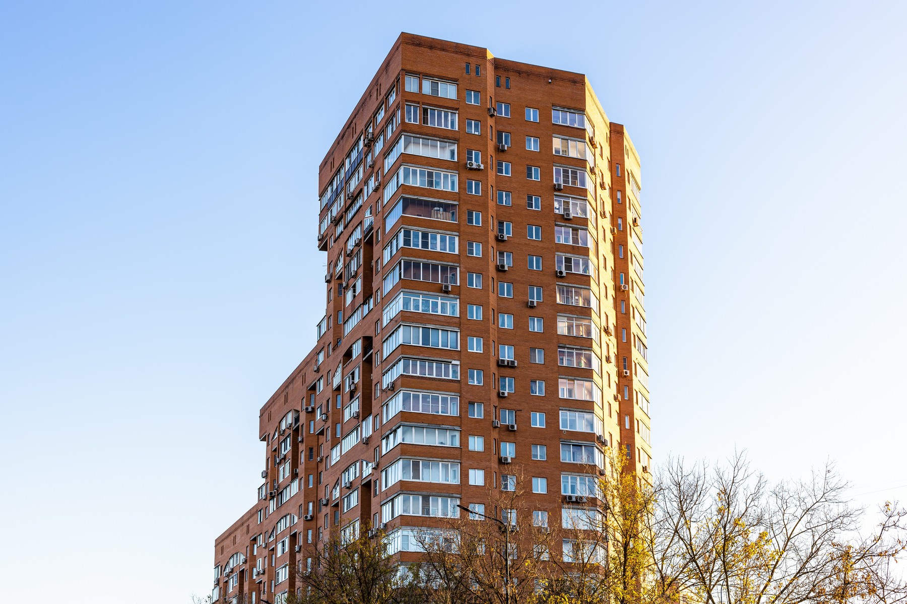 brick apartment building in sunny eveving