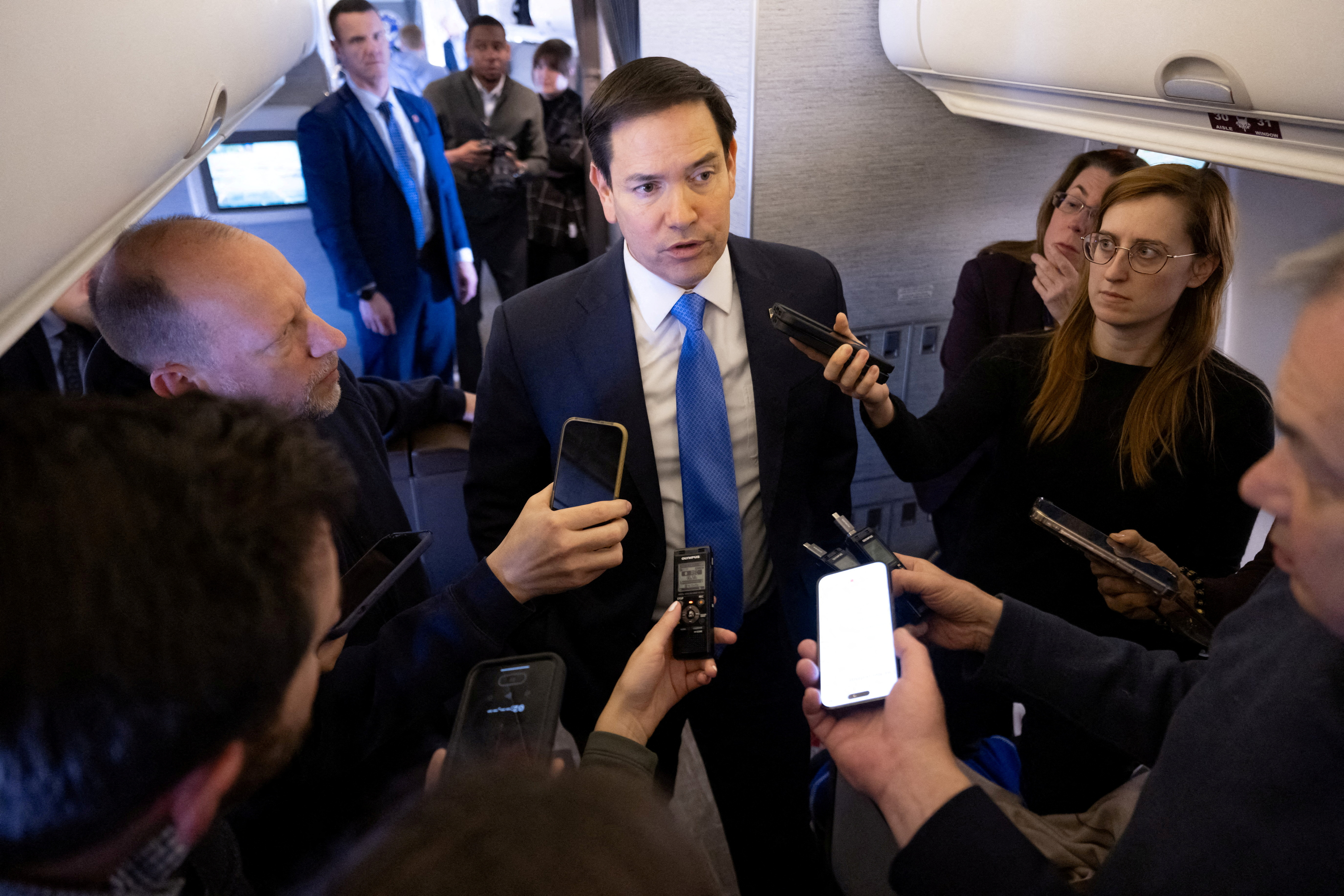 U.S. Secretary of State Marco Rubio speaks with the media on his military airplane as he flies to Jeddah