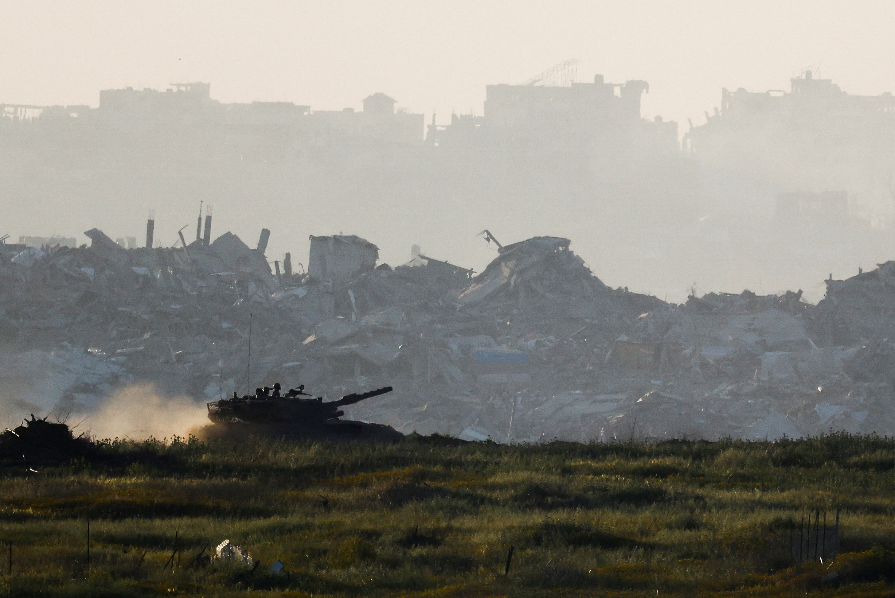 A tank manoeuvres inside Gaza, as seen from Israel's border with Gaza
