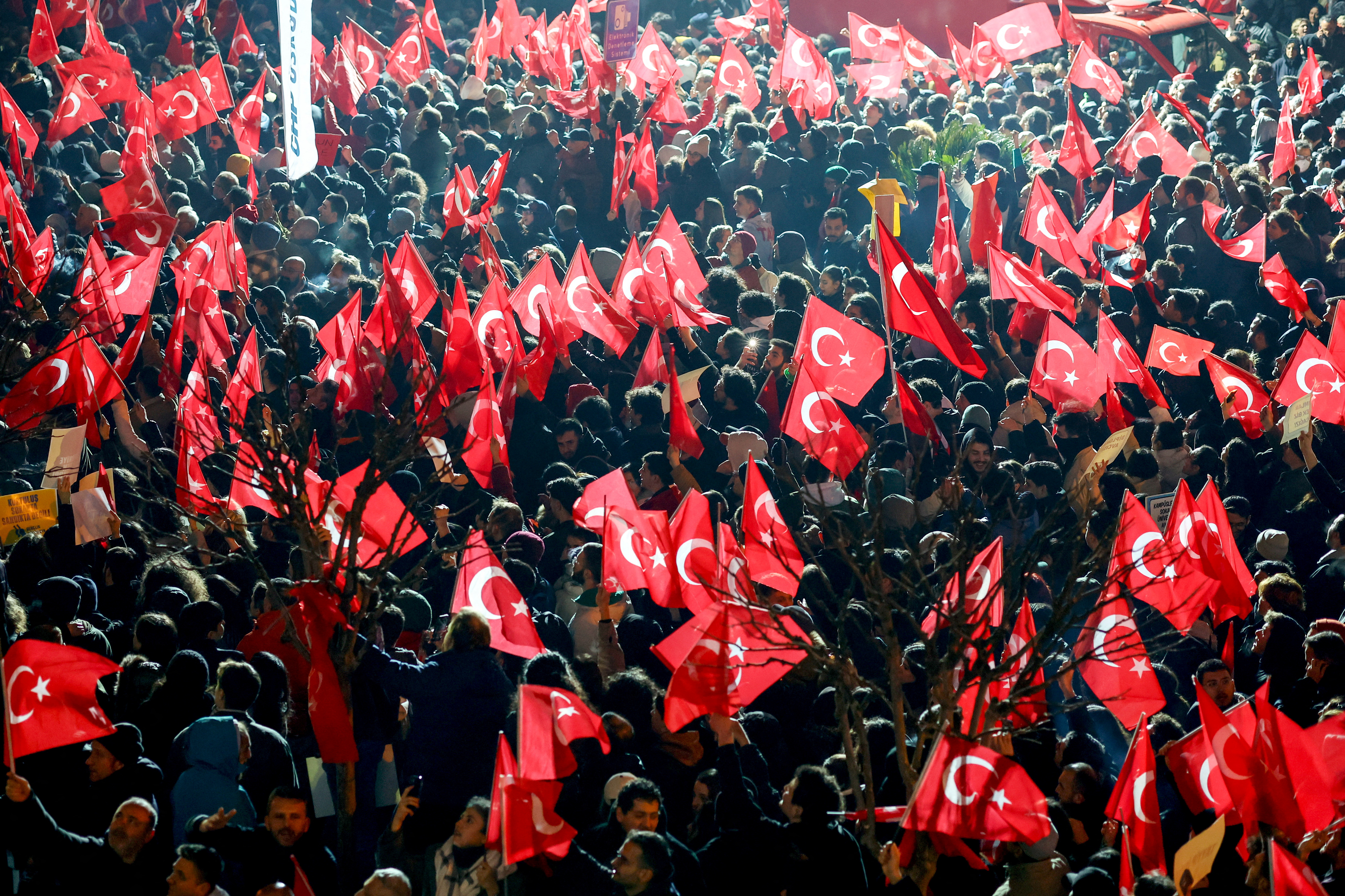 Supporters of Istanbul Mayor Ekrem Imamoglu gather outside the Istanbul Metropolitan Municipality building to protest the detention of Imamoglu, in Istanbul