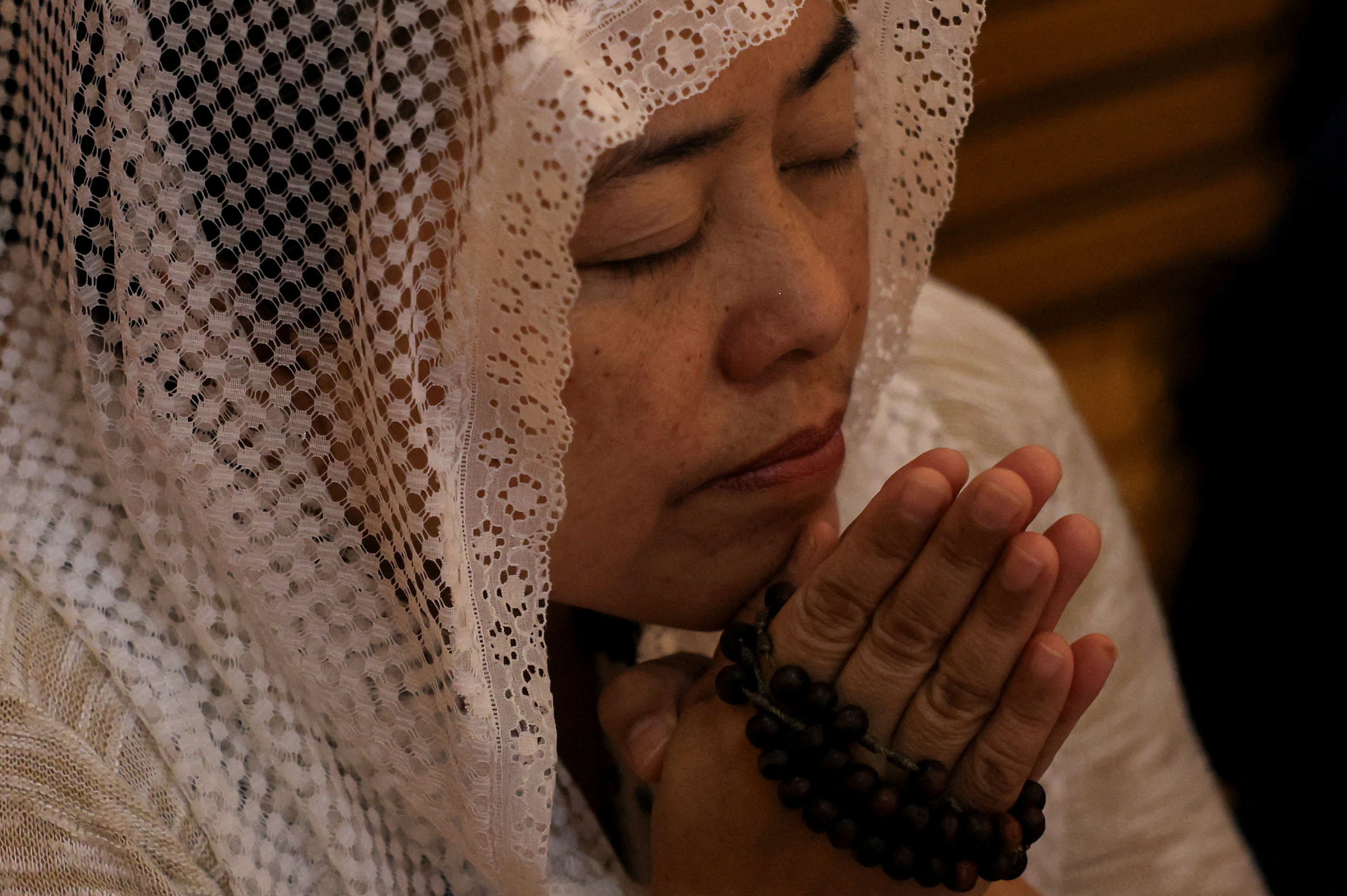 Christians attend a Requiem Mass for Pope Francis at the St. Francis of Assisi Catholic Church, in Dubai