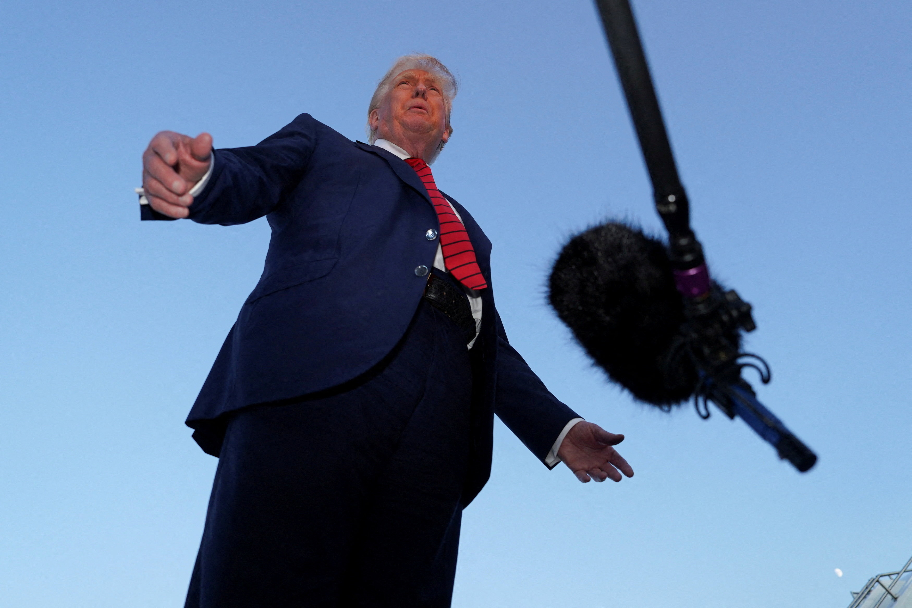 U.S. President Donald Trump talks to members of the press at Lehigh Valley International Airport in Allentown, Pennsylvania, U.S., August 3, 2025. REUTERS/Ken Cedeno     TPX IMAGES OF THE DAY