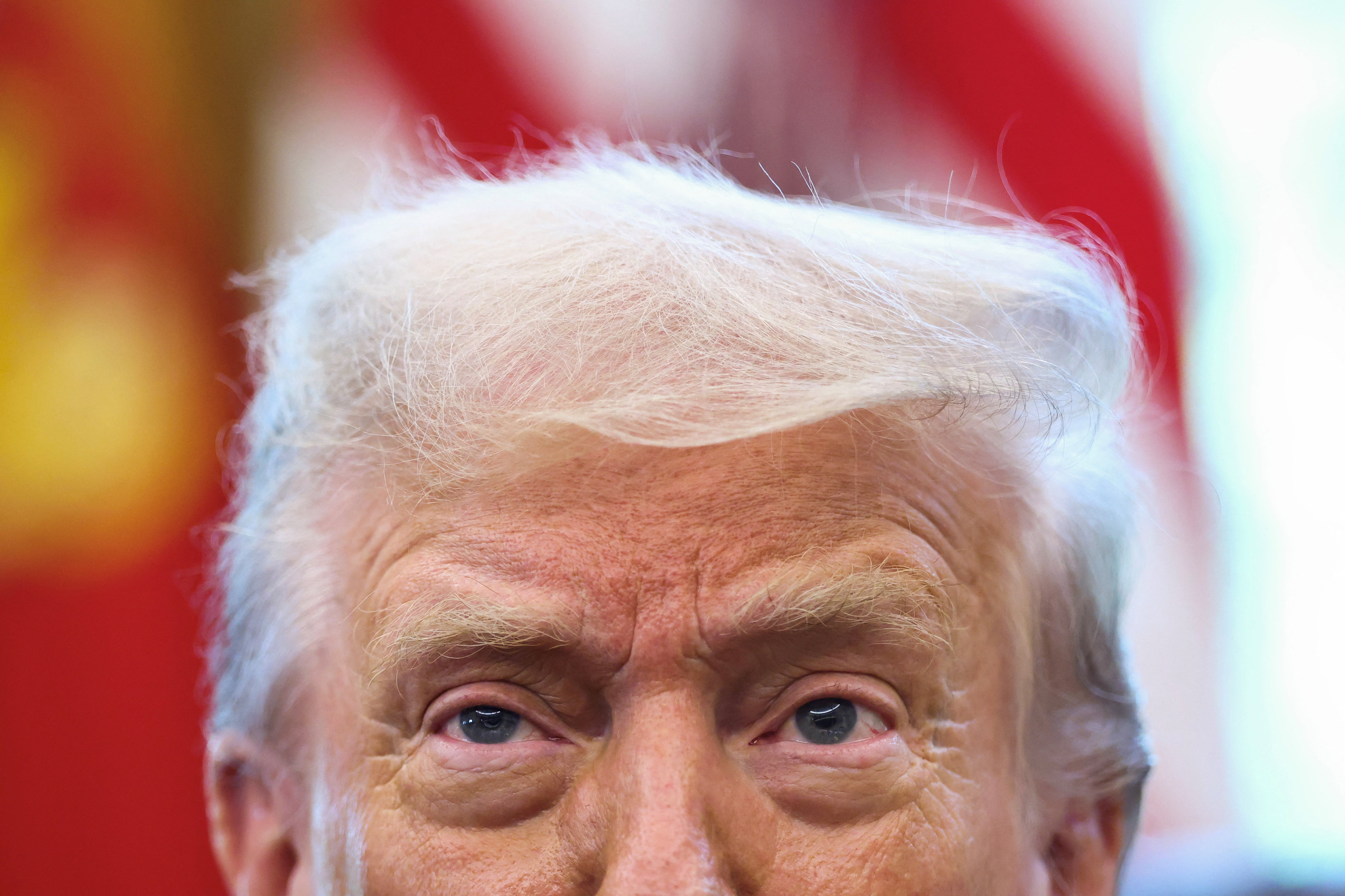 U.S. President Donald Trump looks on, in the Oval Office at the White House in Washington, D.C., U.S., August 14, 2025. REUTERS/Kevin Lamarque