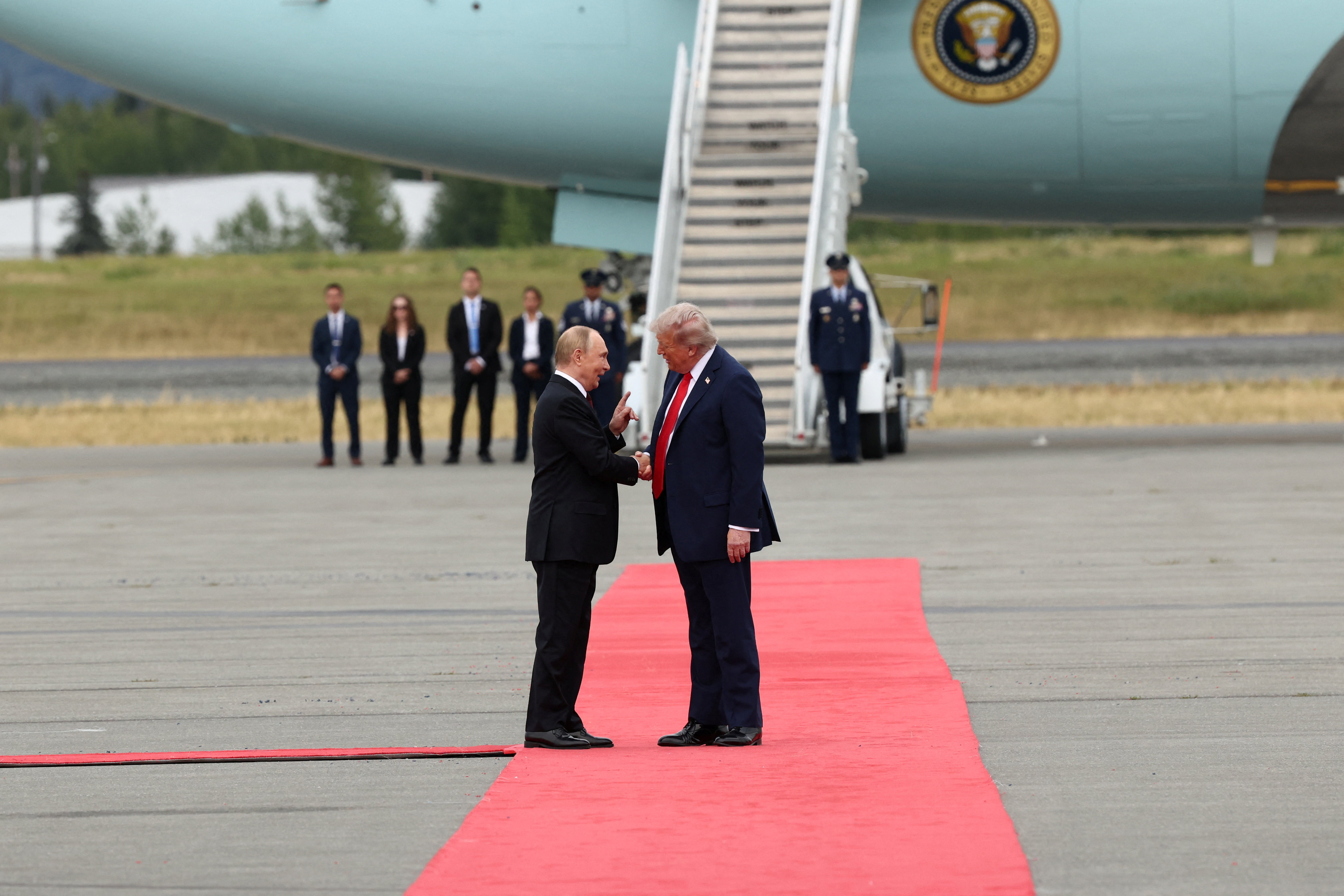 U.S. President Donald Trump shakes hand with Russian President Vladimir Putin, as they meet to negotiate for an end to the war in Ukraine, at Joint Base Elmendorf-Richardson in Anchorage, Alaska, U.S., August 15, 2025. REUTERS/Kevin Lamarque
