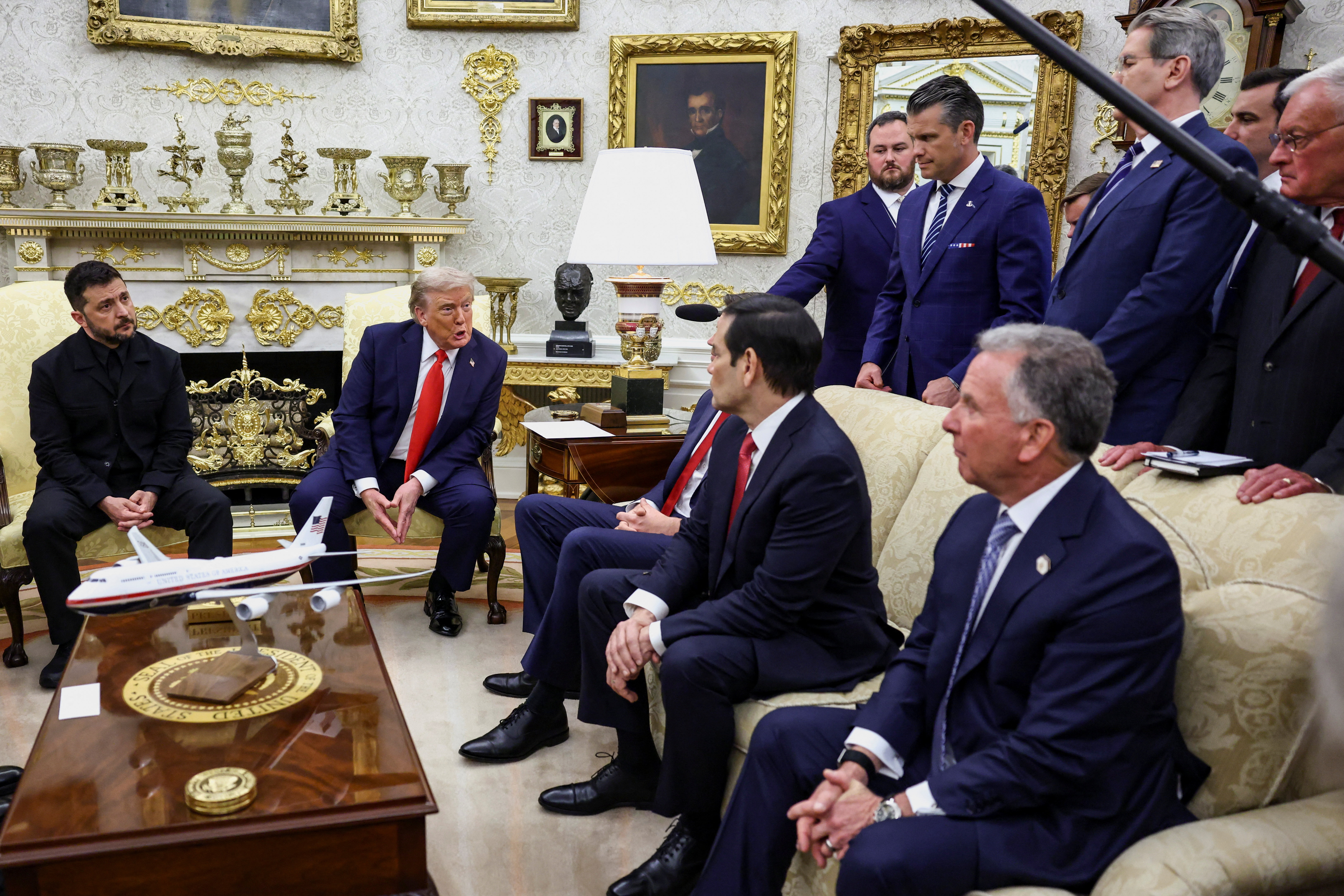 U.S. President Donald Trump speaks towards U.S. Vice President JD Vance and Secretary of State Marco Rubio during a meeting with Ukrainian President Volodymyr Zelenskiy at the Oval Office