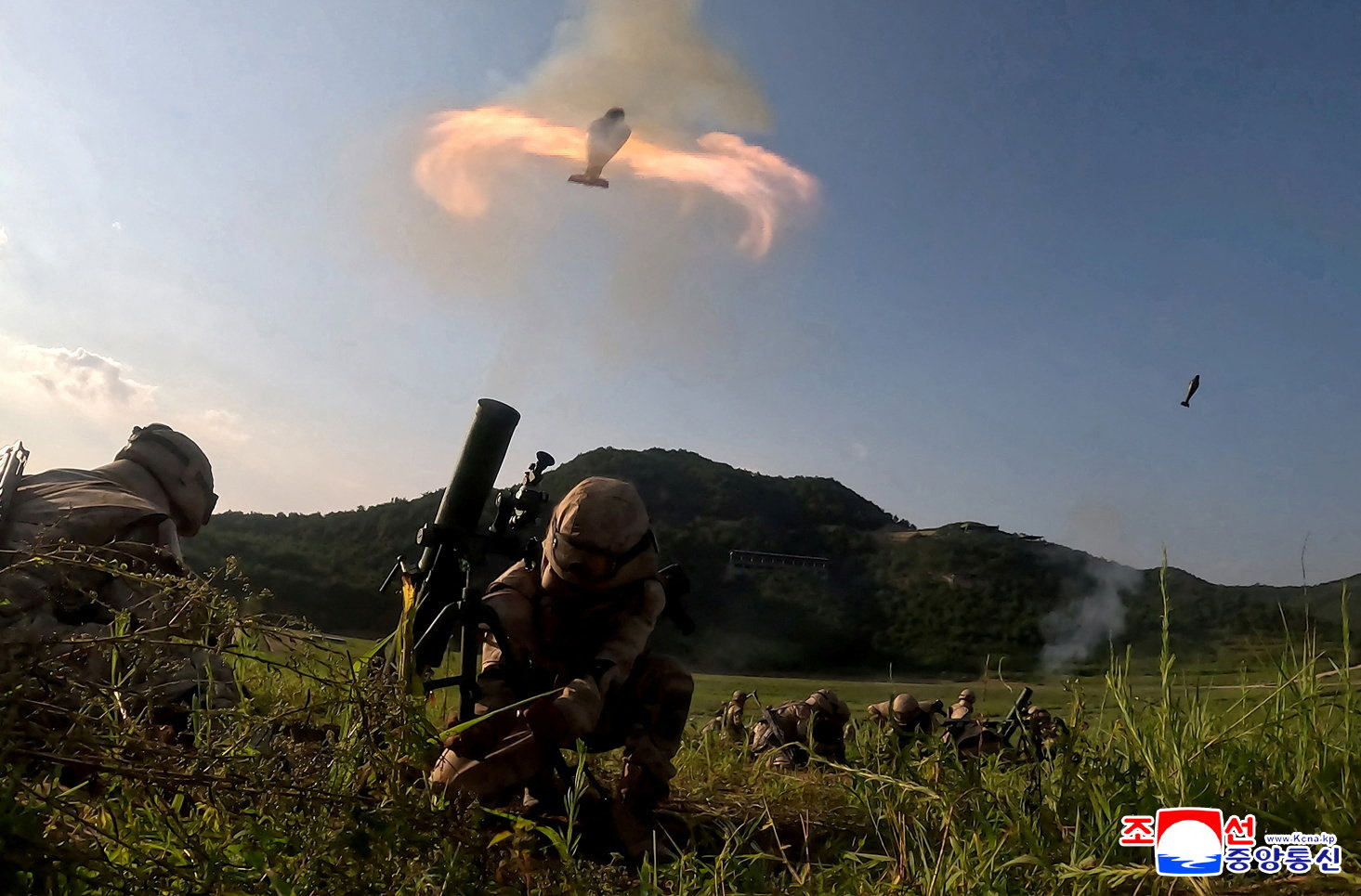Members of the tactical artillery units under the large combined units of the Korean People's Army take part in a shooting training competition at an unknown location in this handout image released on August 12, 2025.