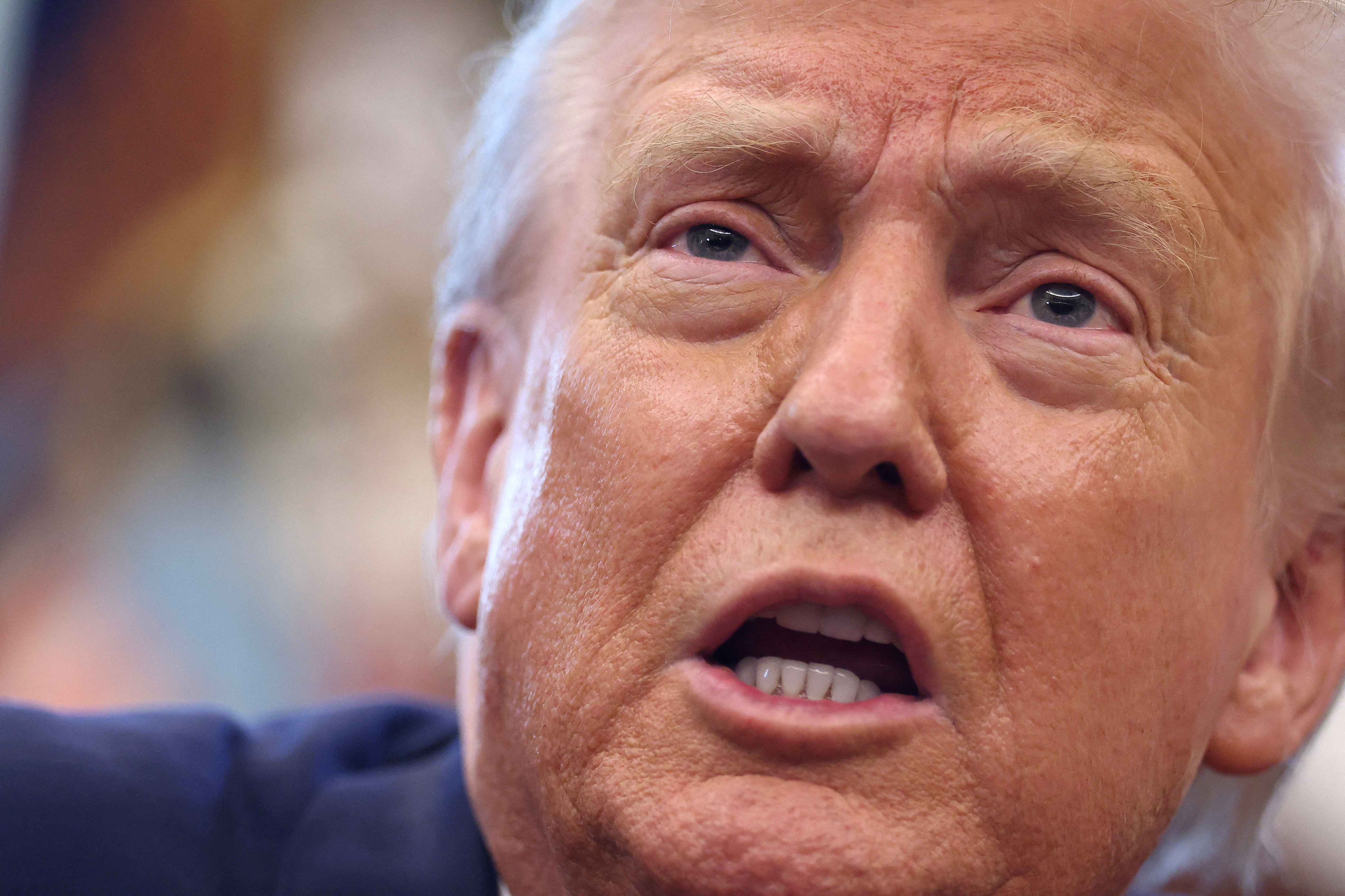 FILE PHOTO: U.S. President Donald Trump delivers remarks in the Oval Office at the White House in Washington, D.C., U.S., August 14, 2025. REUTERS/Kevin Lamarque/File Photo