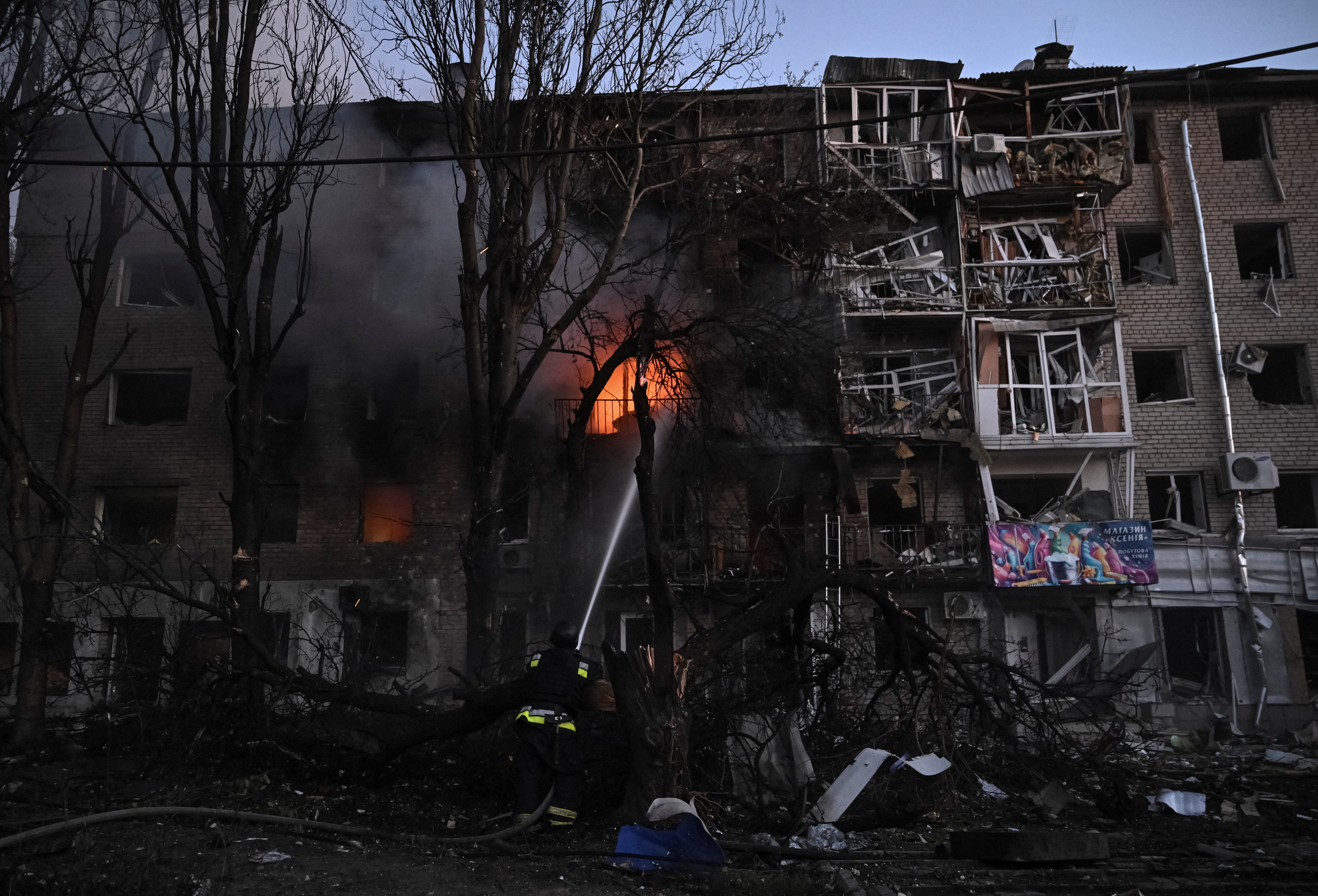 A firefighter works at the site of an apartment building hit during a Russian drone and missile strike, amid Russia's attack on Ukraine, in Zaporizhzhia, Ukraine August 30, 2025. REUTERS/Stringer