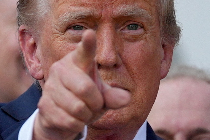 FILE PHOTO: U.S. President Donald Trump gestures after signing the sweeping spending and tax legislation, known as the "One Big Beautiful Bill Act," at the White House in Washington, D.C., U.S., July 4, 2025. REUTERS/Leah Millis/File Photo