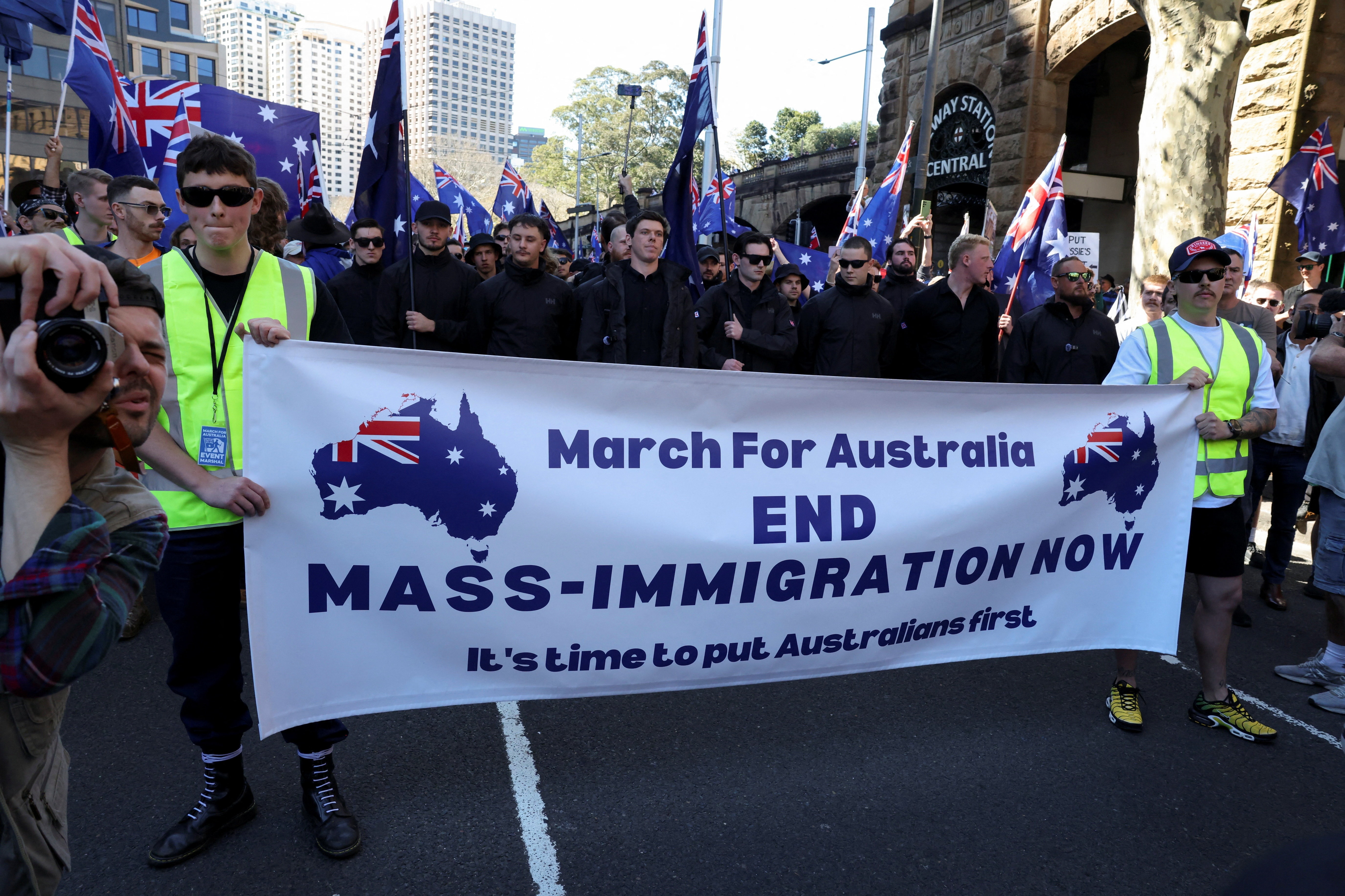 Demonstrators hold a banner during the 'March for Australia' anti-immigration rally, in Sydney, Australia, August 31, 2025. REUTERS/Hollie Adams