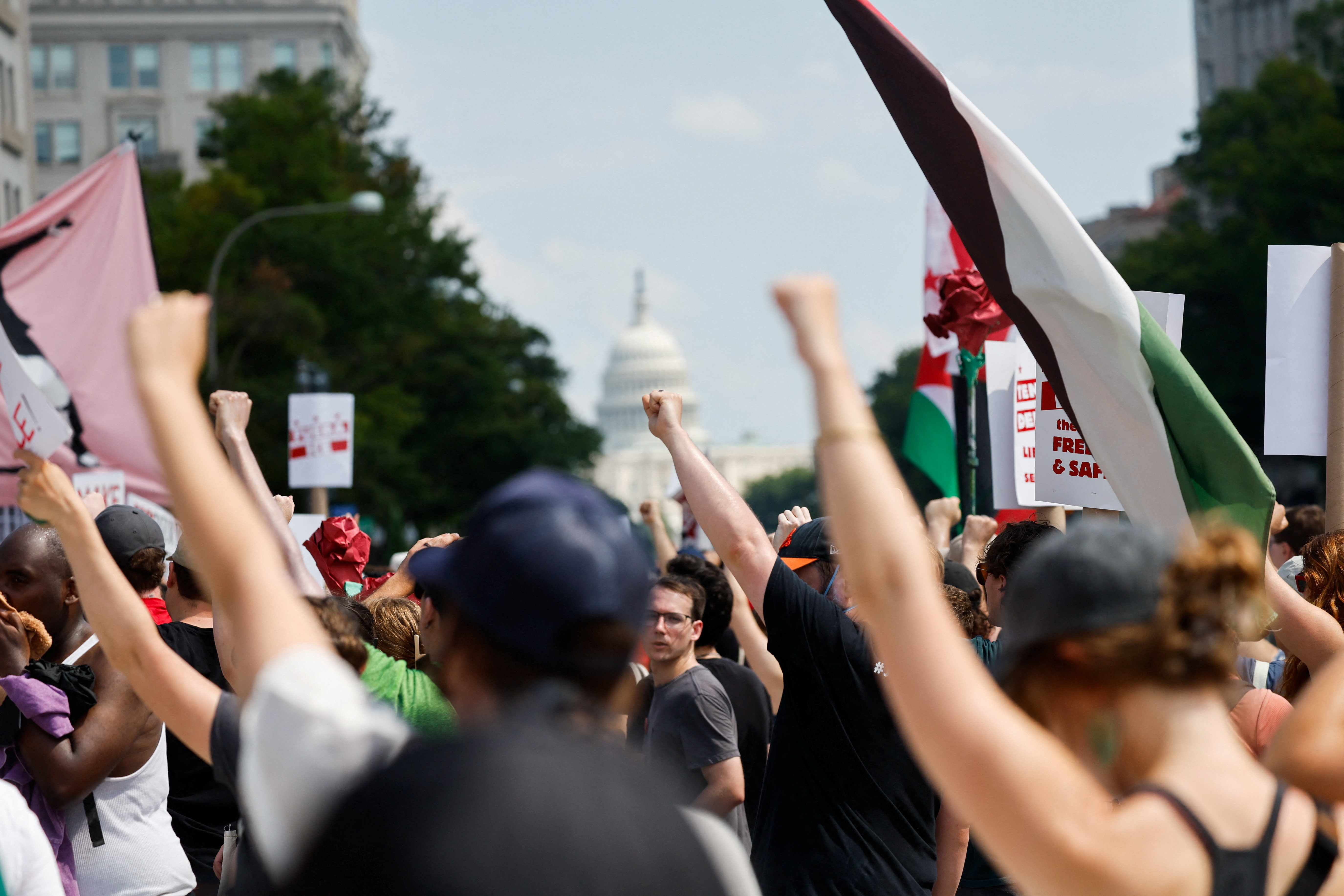 Demonstrators raise their fists, during the "We Are All D.C." march to protest against the National Guard troops, near the U.S. Capitol Building, in Washington, D.C., U.S., September 6, 2025.