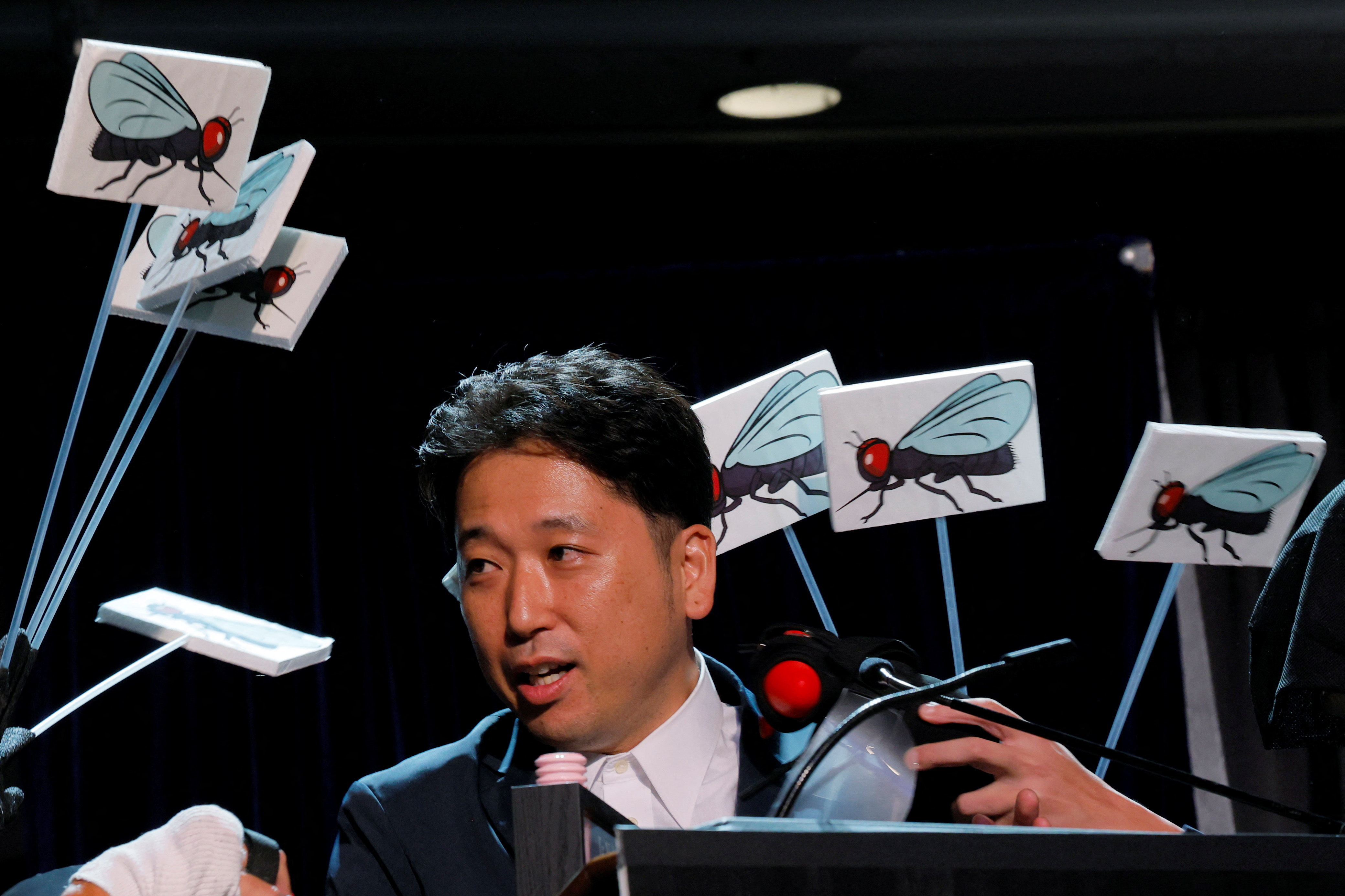 Researcher Tomoki Kojima of Japan accepts the Ig Nobel Prize for Biology,