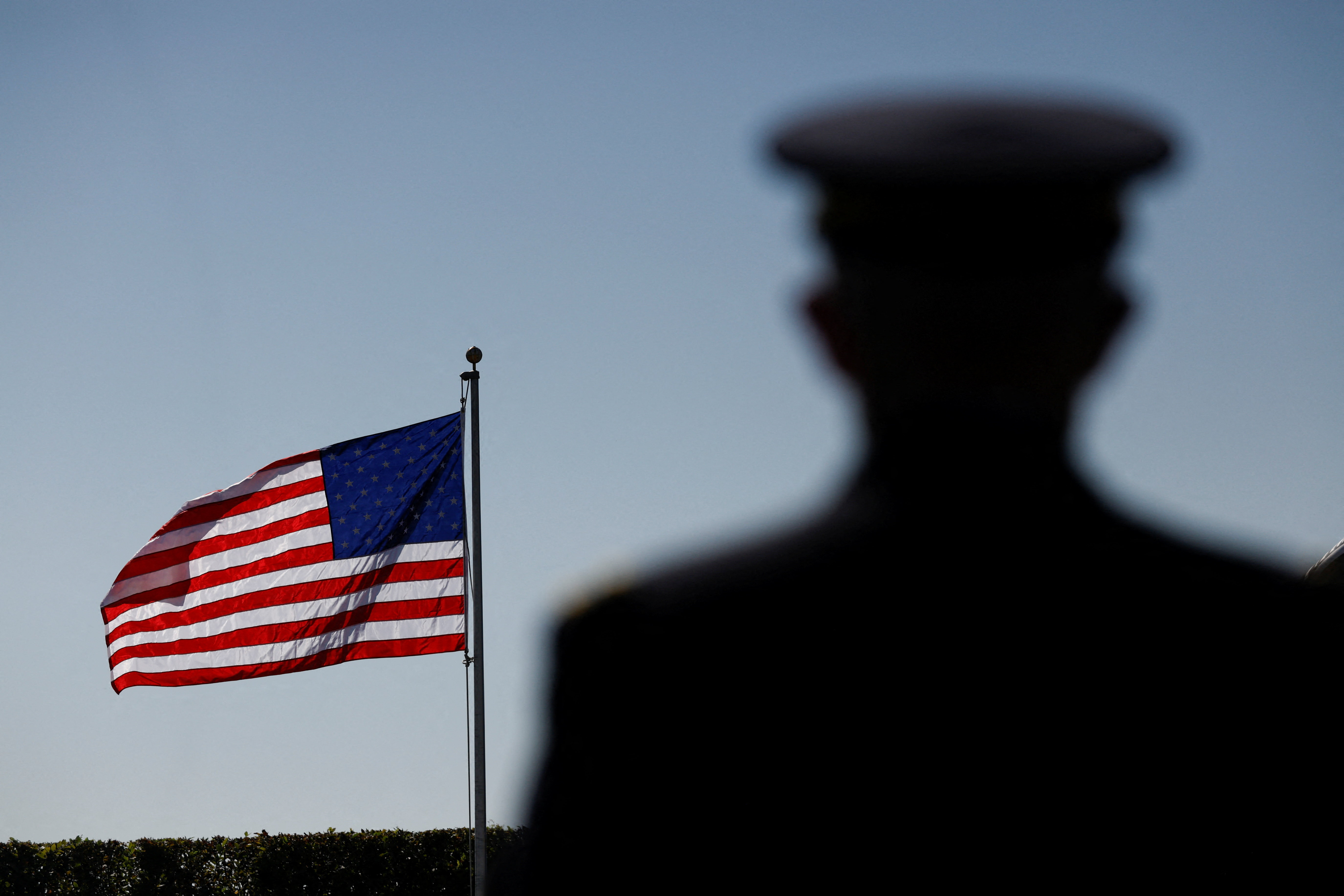 The U.S. flag flutters during a ceremony honoring prisoners of war, at the Pentagon in Washington, D.C. U.S., September 19, 2025. REUTERS/Daniel Becerril