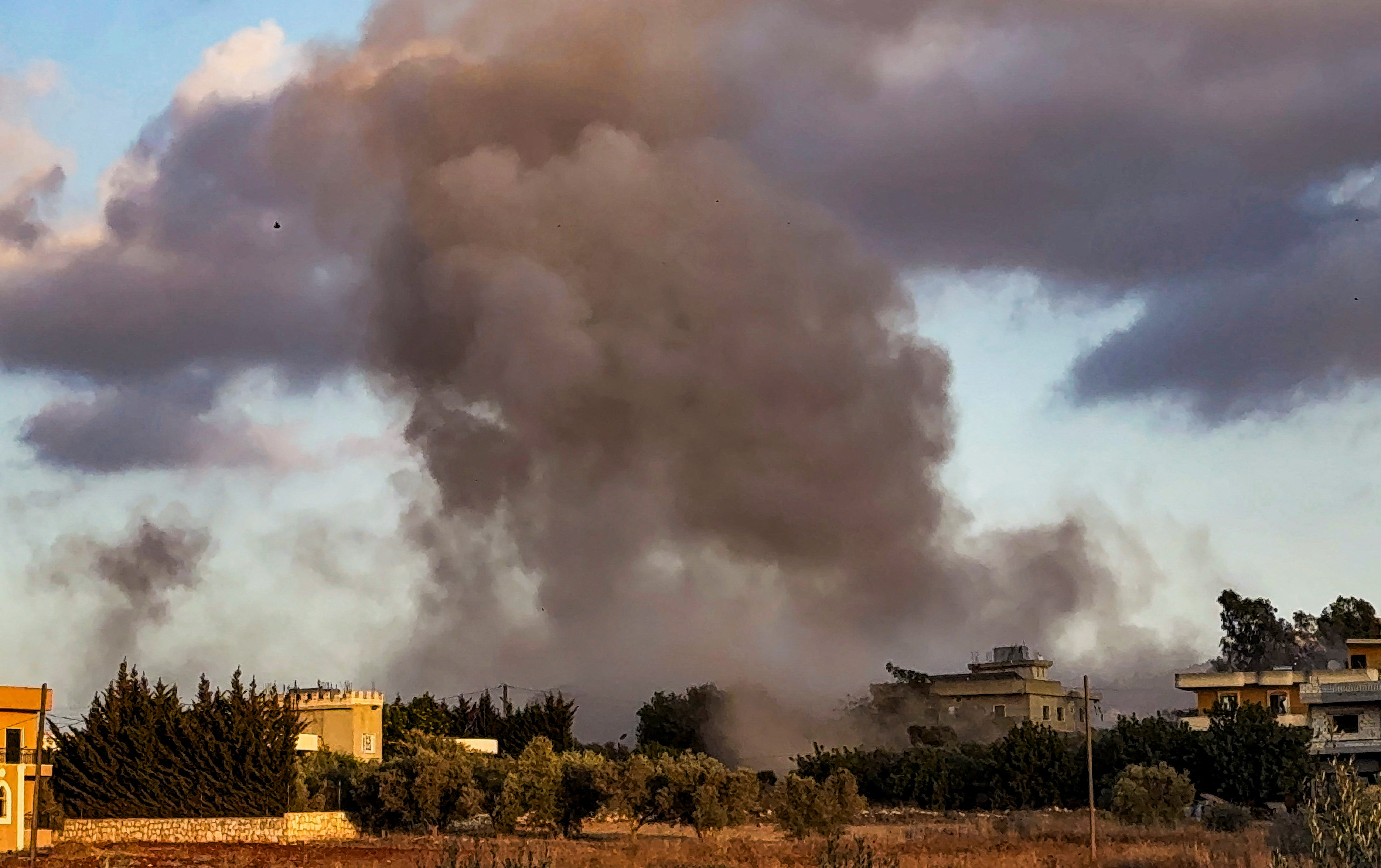 Smoke billows over Kfar Tebnit after an Israeli strike near Lebanon’s border with Israel, in Lebanon, September 18, 2025.