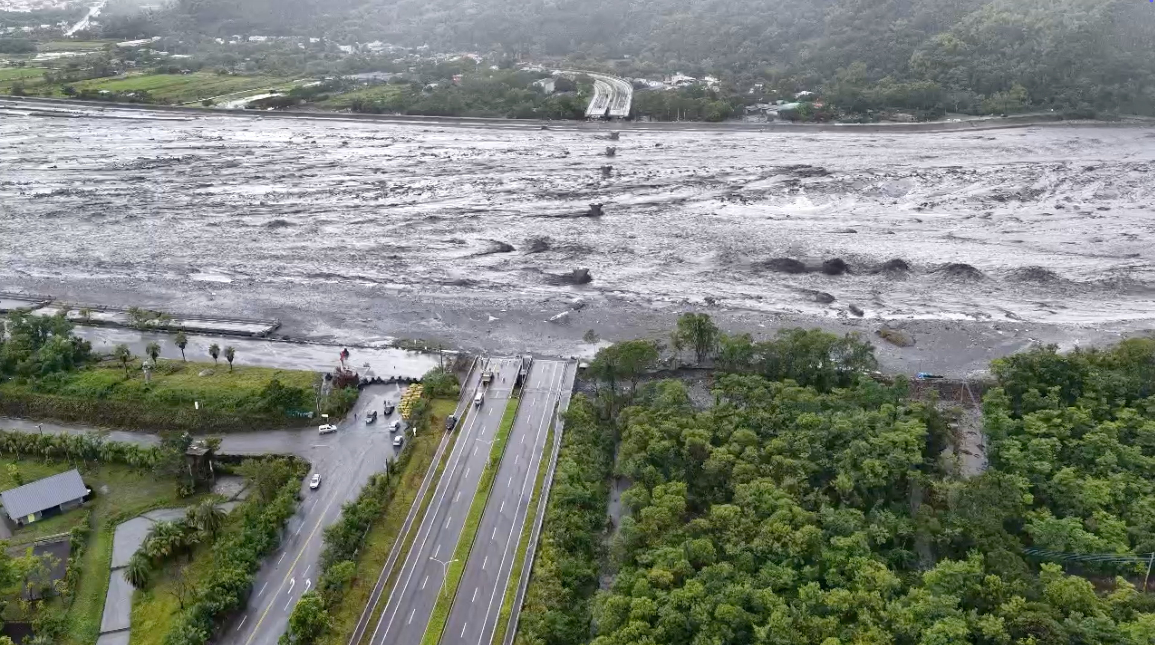 A drone view shows a collapsed bridge submerged in flood waters, in the aftermath of  Super Typhoon Ragasa, in Guangfu township, Hualien County, Taiwan