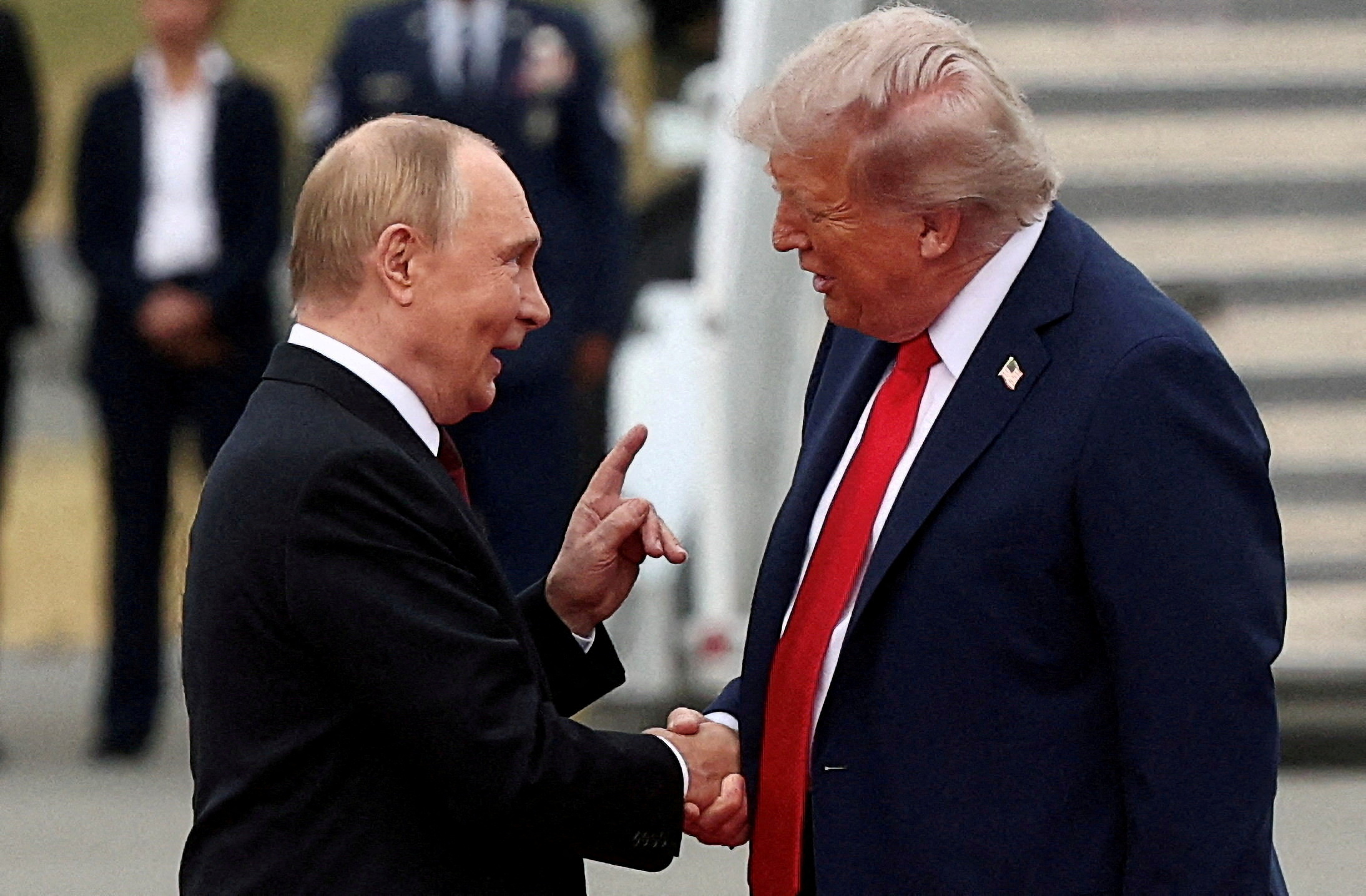 U.S. President Donald Trump shakes hand with Russian President Vladimir Putin, as they meet to negotiate for an end to the war in Ukraine, at Joint Base Elmendorf-Richardson in Anchorage, Alaska