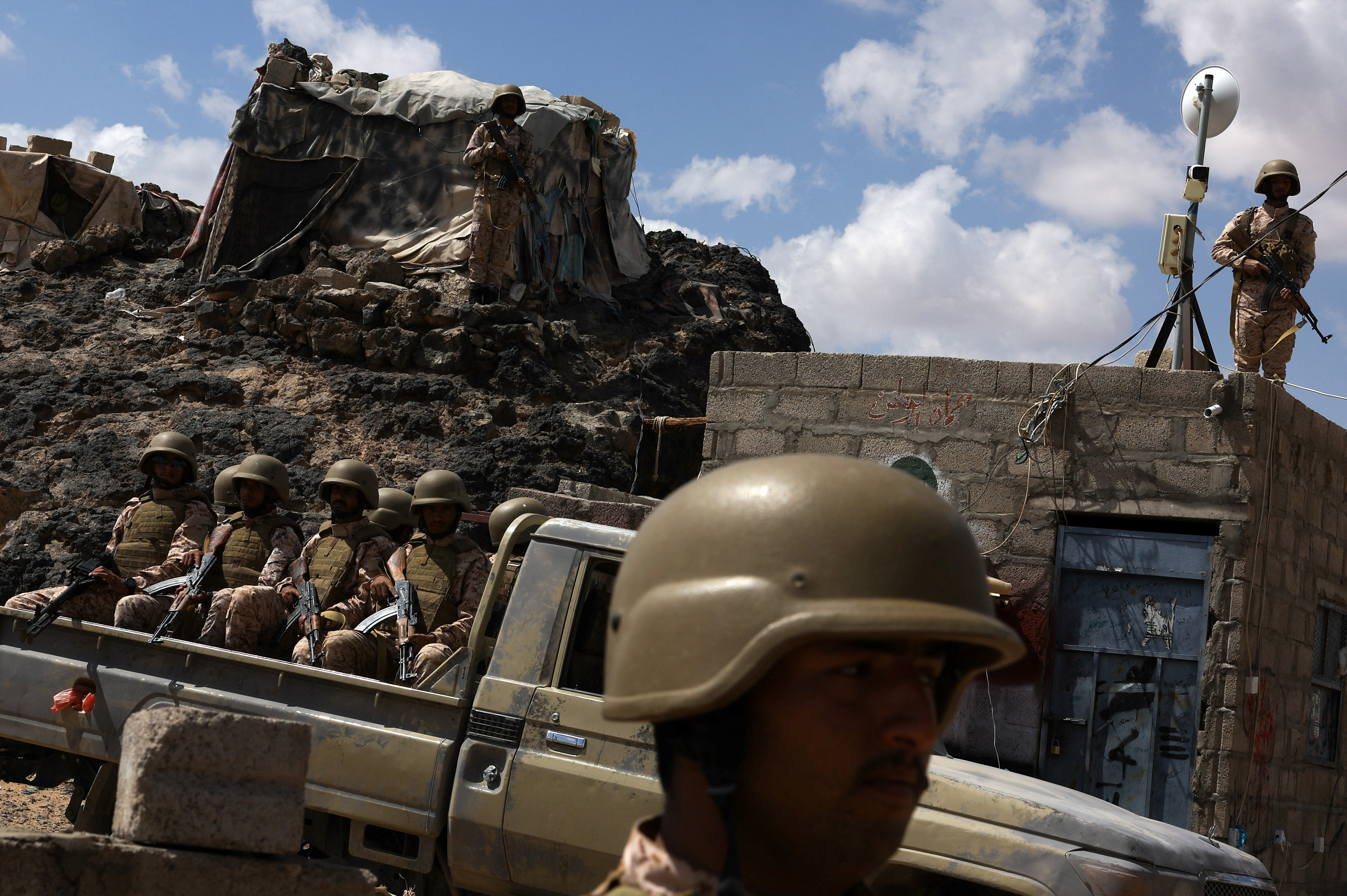 Yemeni soldiers stand guard at a military camp near the frontline with Houthis, in Marib, Yemen, November 6, 2024.    To match Special Report YEMEN-HOUTHIS/POVERTY