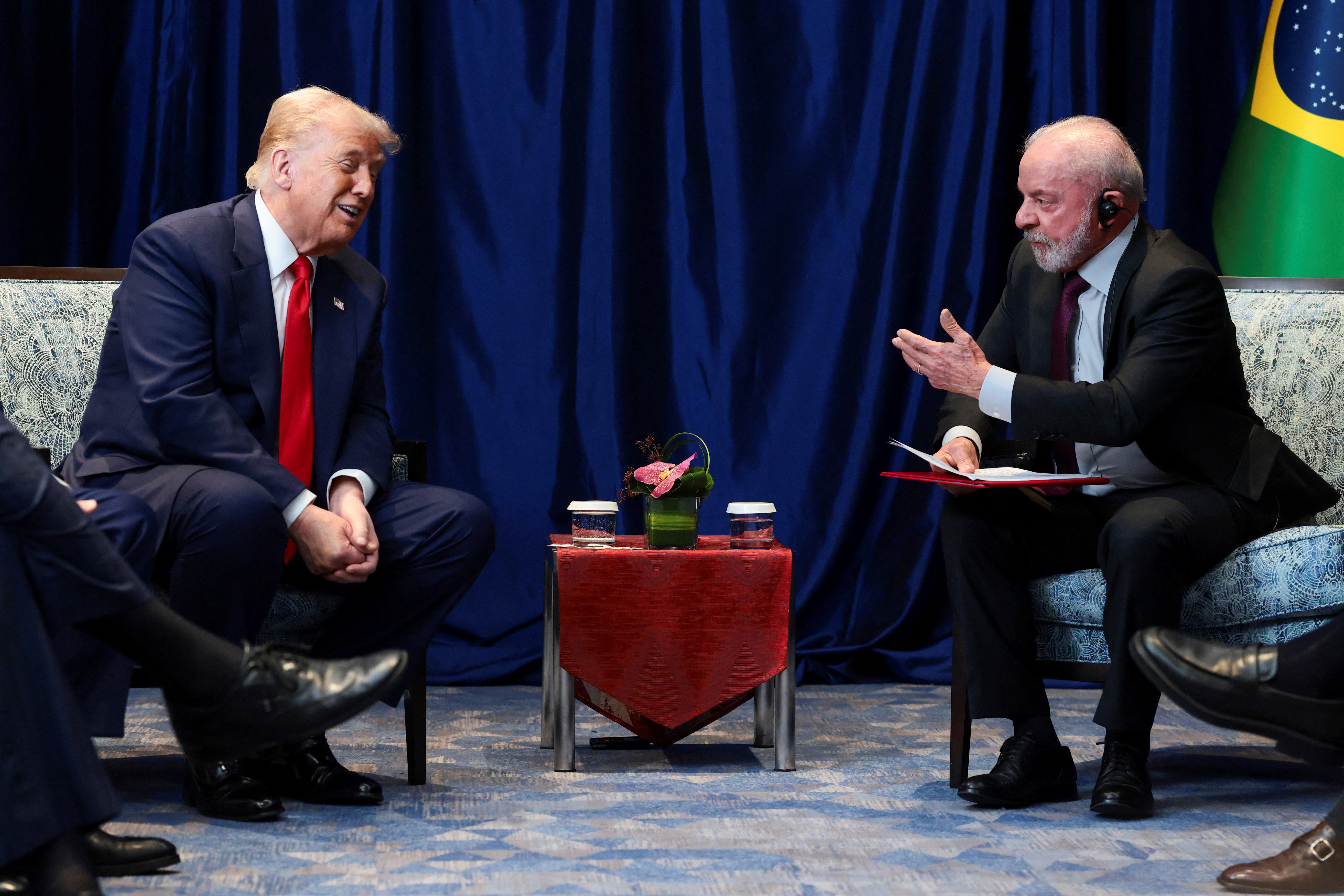U.S. President Donald Trump and Brazilian President Luiz Inacio Lula da Silva talk as they meet on the sidelines of the 47th Association of Southeast Asian Nations