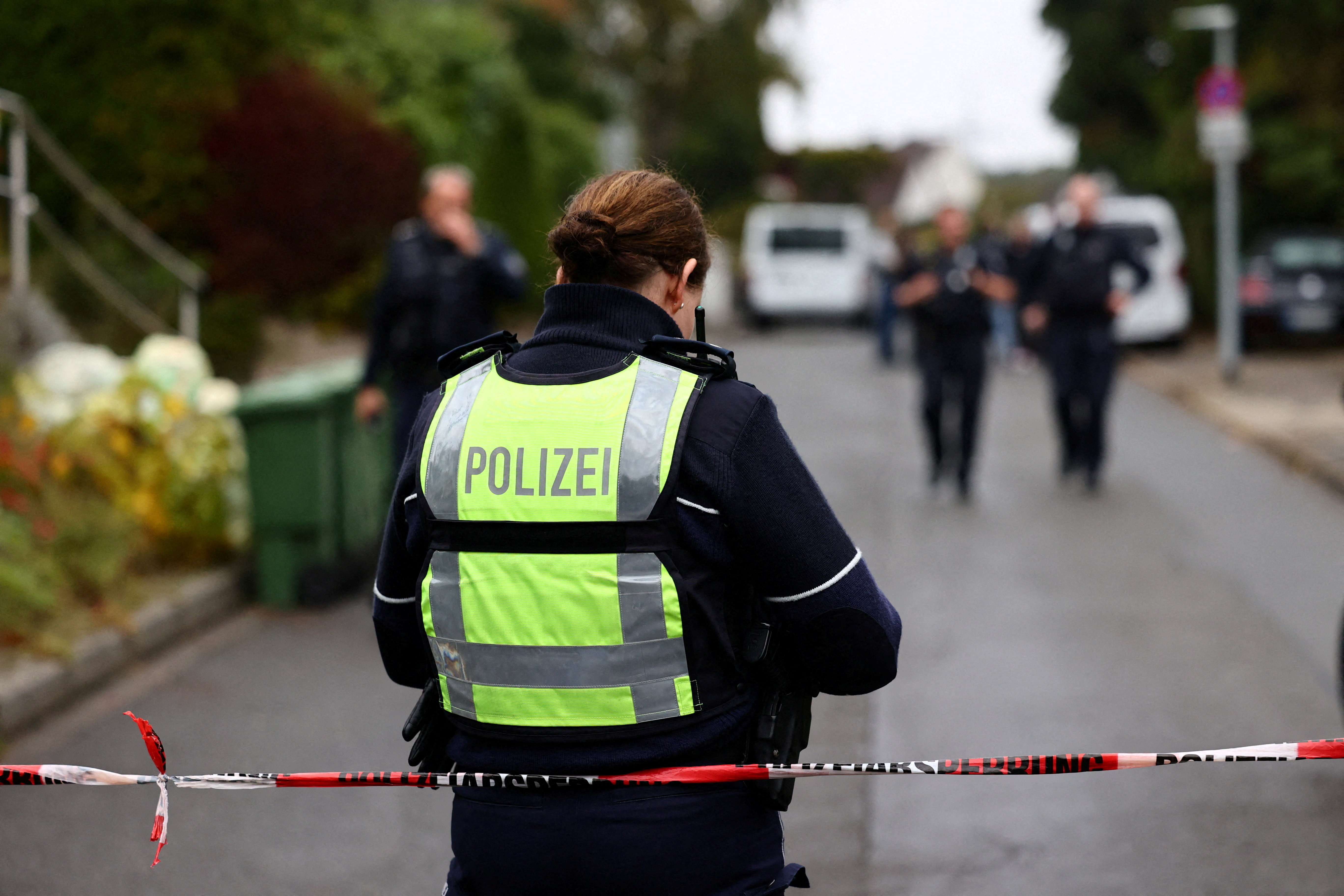 A police officer works at the scene after Herdecke's newly elected Mayor Iris Stalzer was found seriously injured in a stabbing incident, in Herdecke, Germany, October 7, 2025.r     TPX IMAGES OF THE DAY