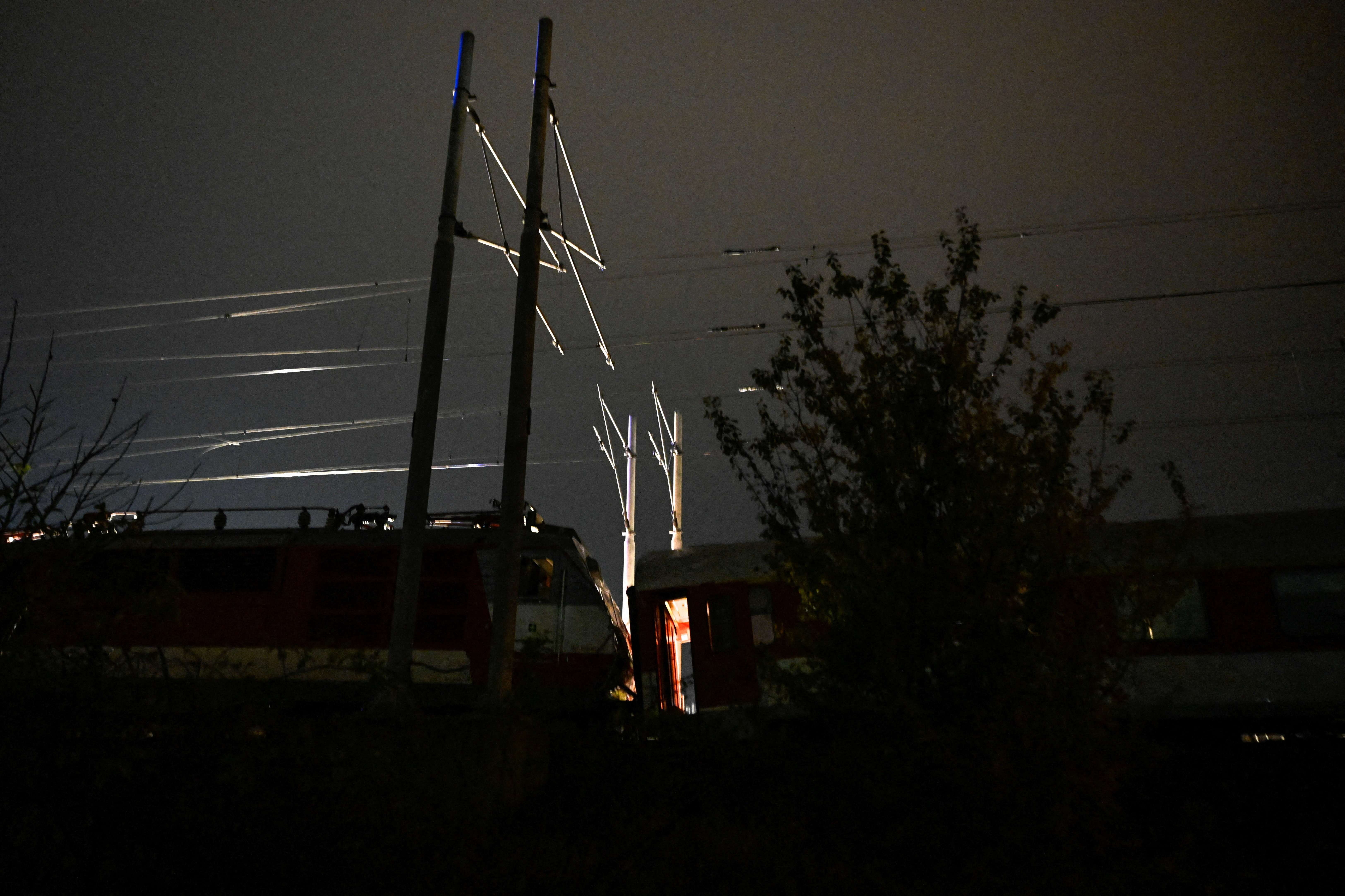 A view shows the scene of a collision between two trains in the town of Pezinok, Slovakia, November 9, 2025. REUTERS/Radovan Stoklasa