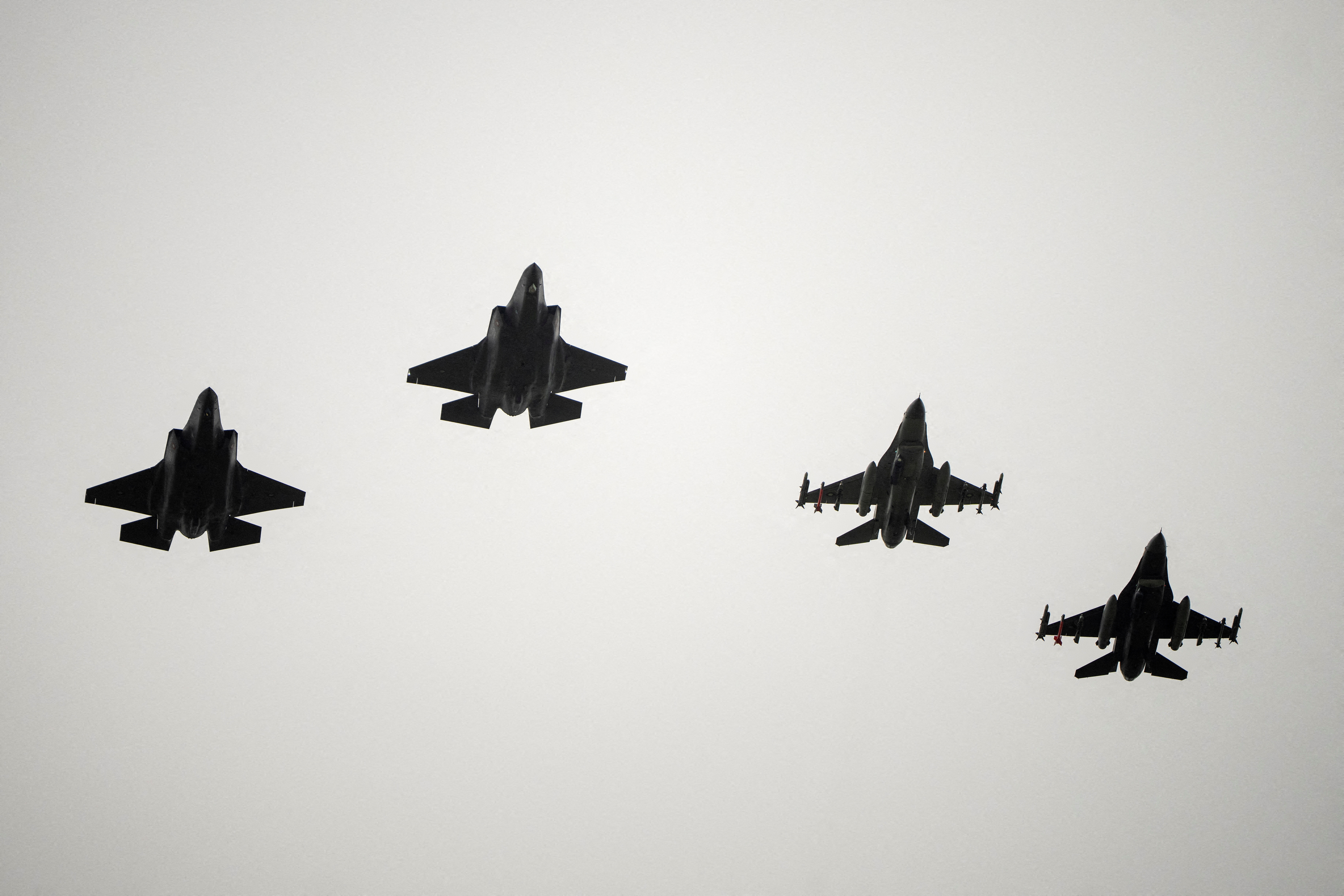 Two F-16 and two F-35 fighter jets return to air base Flyvestation Skrydstrup after patrolling around Denmark at low altitude