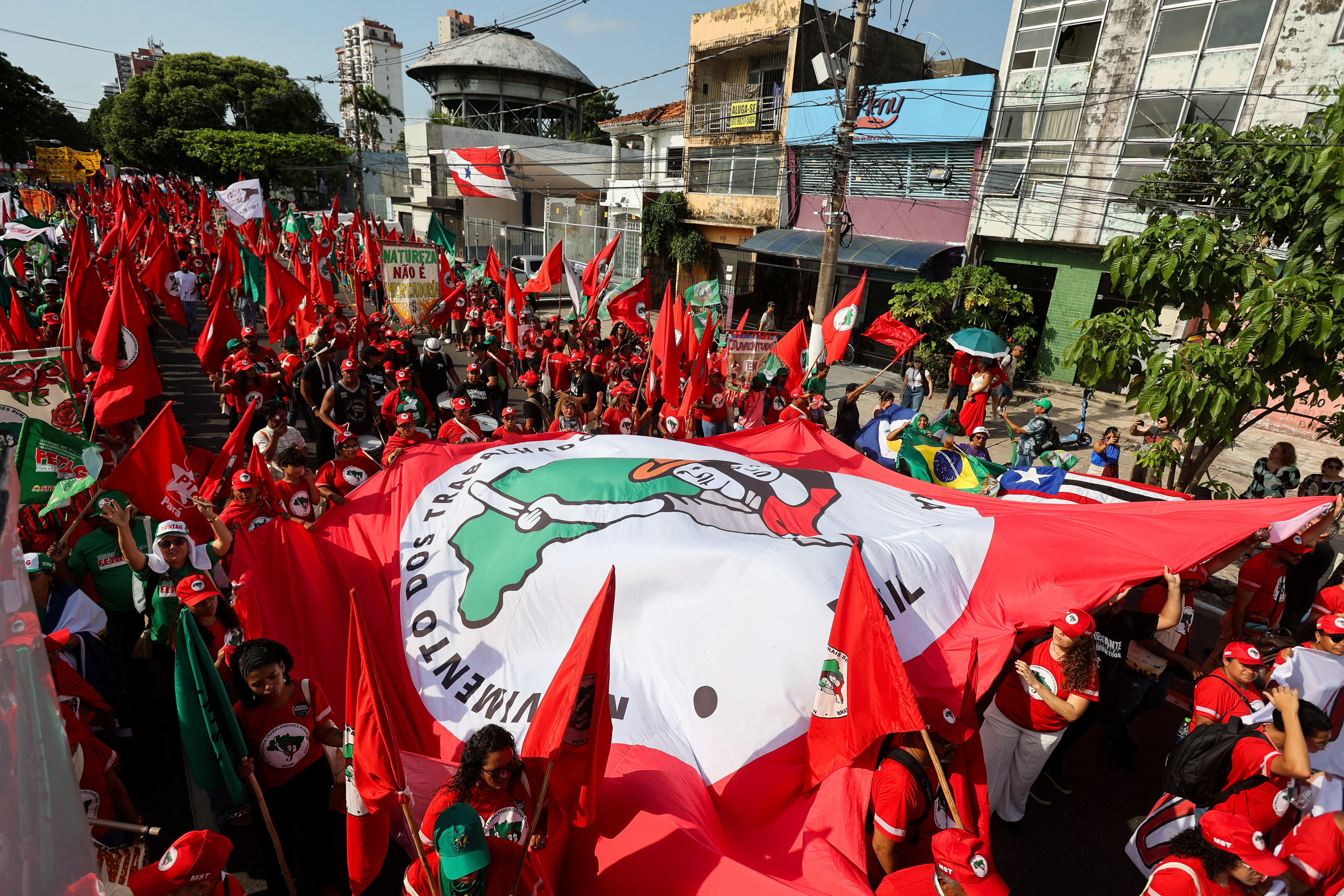 Demonstrators attend a protest to call for climate justice and territorial protection during the U.N. Climate Change Conference (COP30), in Belem, Brazil,