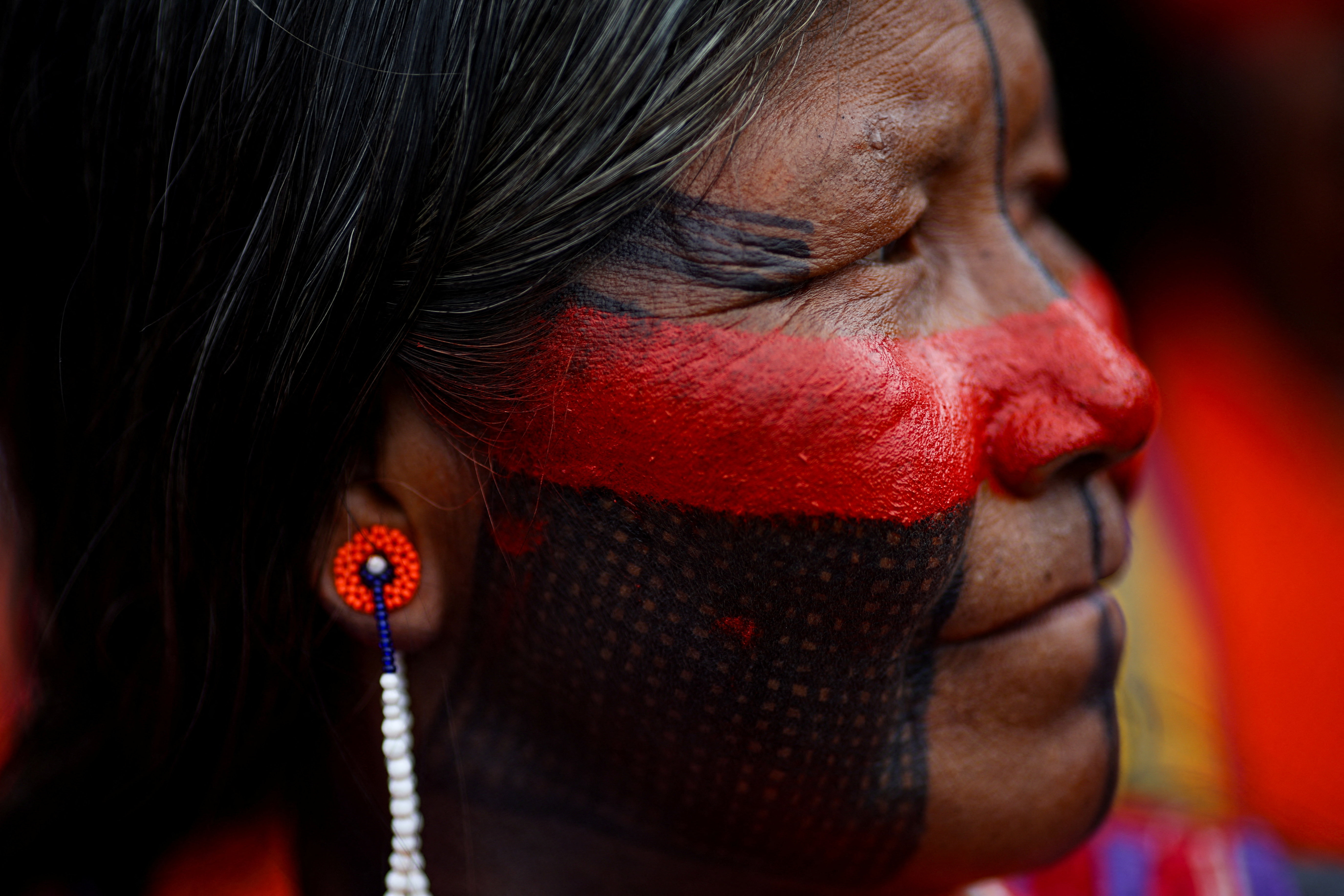 An indigenous woman attends a protest to call for climate justice and territorial protection during the U.N. Climate Change Conference (COP30), in Belem, Brazil, November 15, 2025.