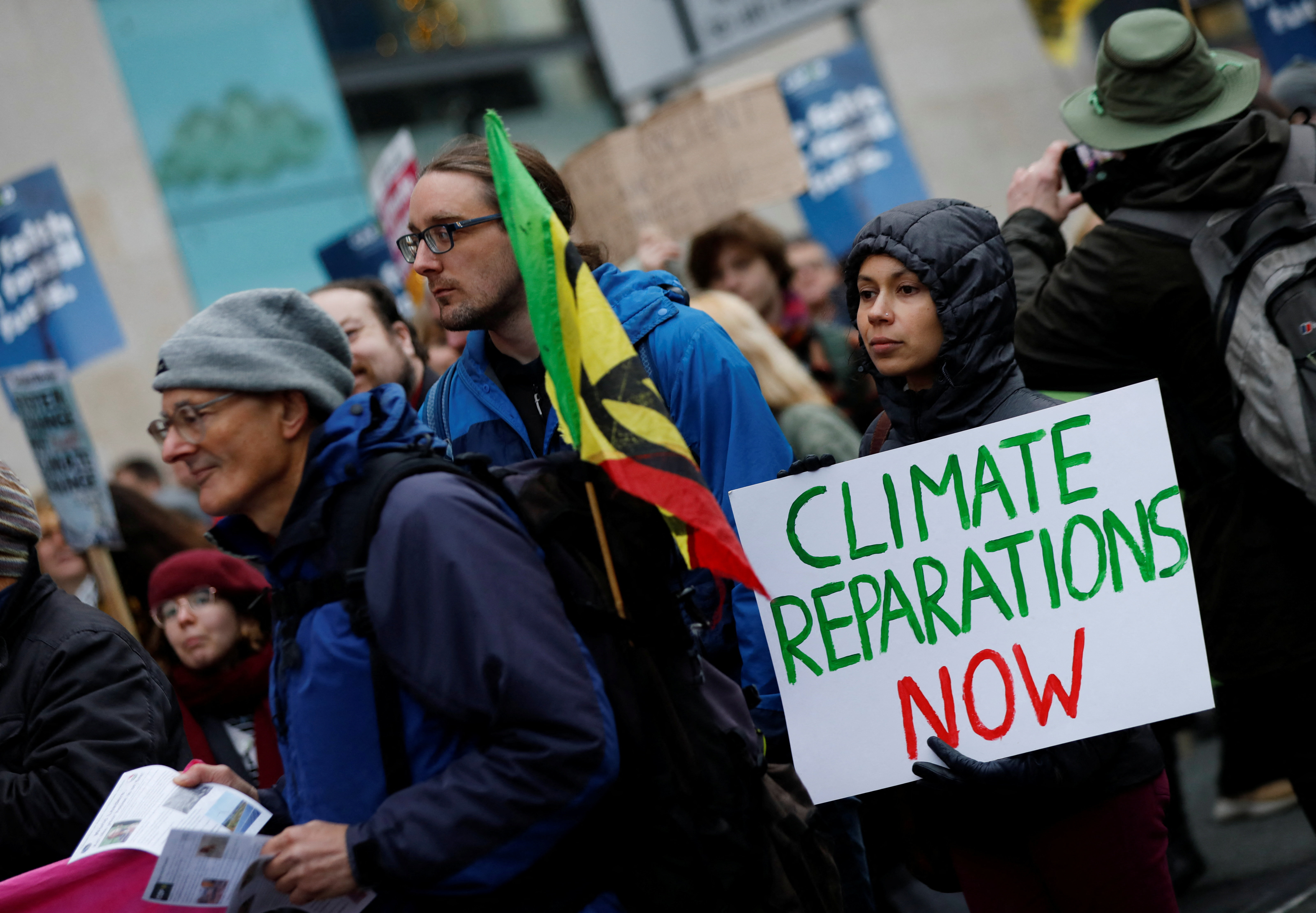 Demonstrators carry placards as people take part in a nationwide protest calling for stronger global climate actions, during the ongoing U.N. Climate Change Conference (COP30) in Brazil, in Manchester, Britain, November 15, 2025.