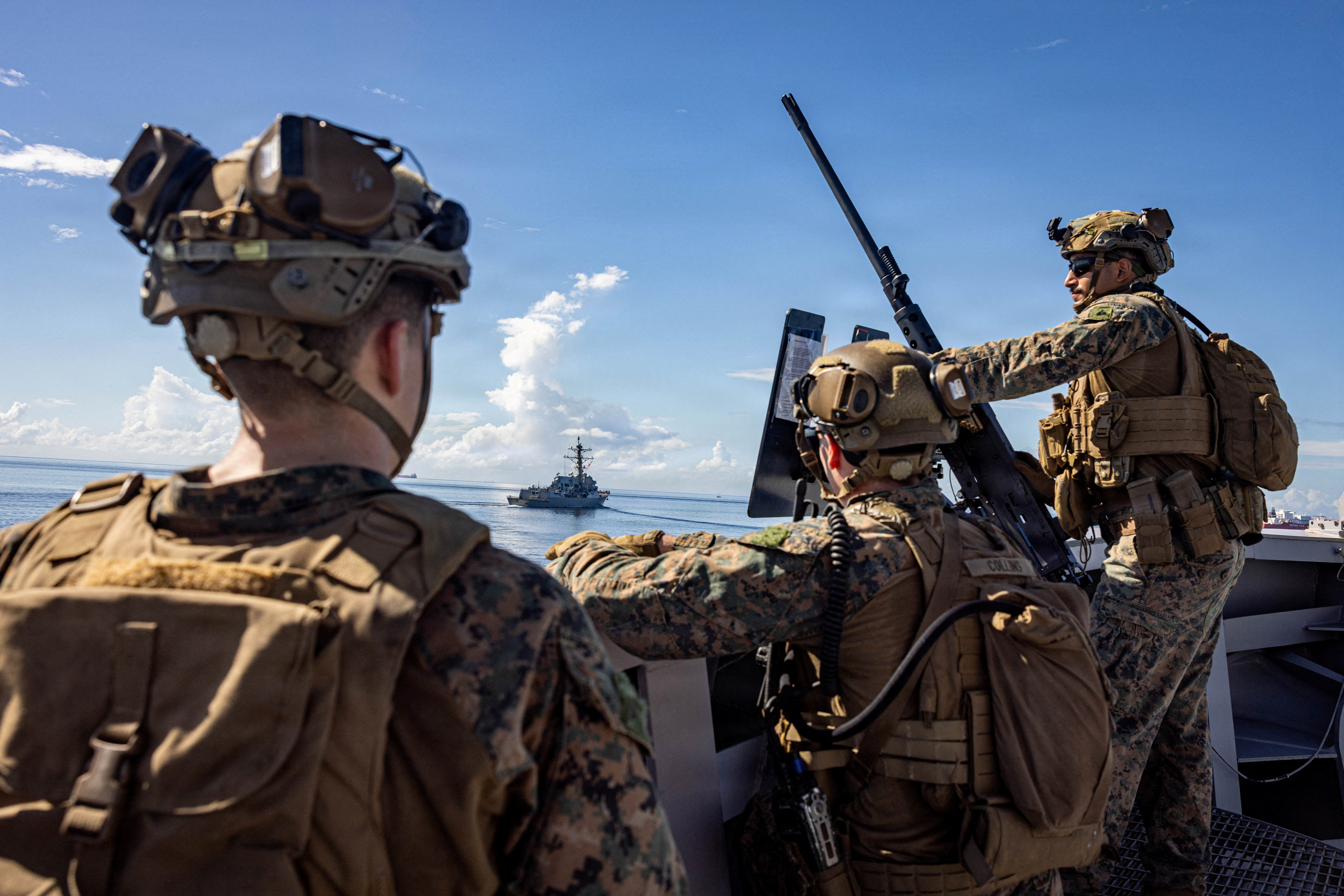 U.S. Marines keep watch during a strait transit while underway in the Caribbean Sea, November 18, 2025.   Sgt. Nathan Mitchell/U.S. Marine Corps/Handout via REUTERS  THIS IMAGE HAS BEEN SUPPLIED BY A THIRD PARTY