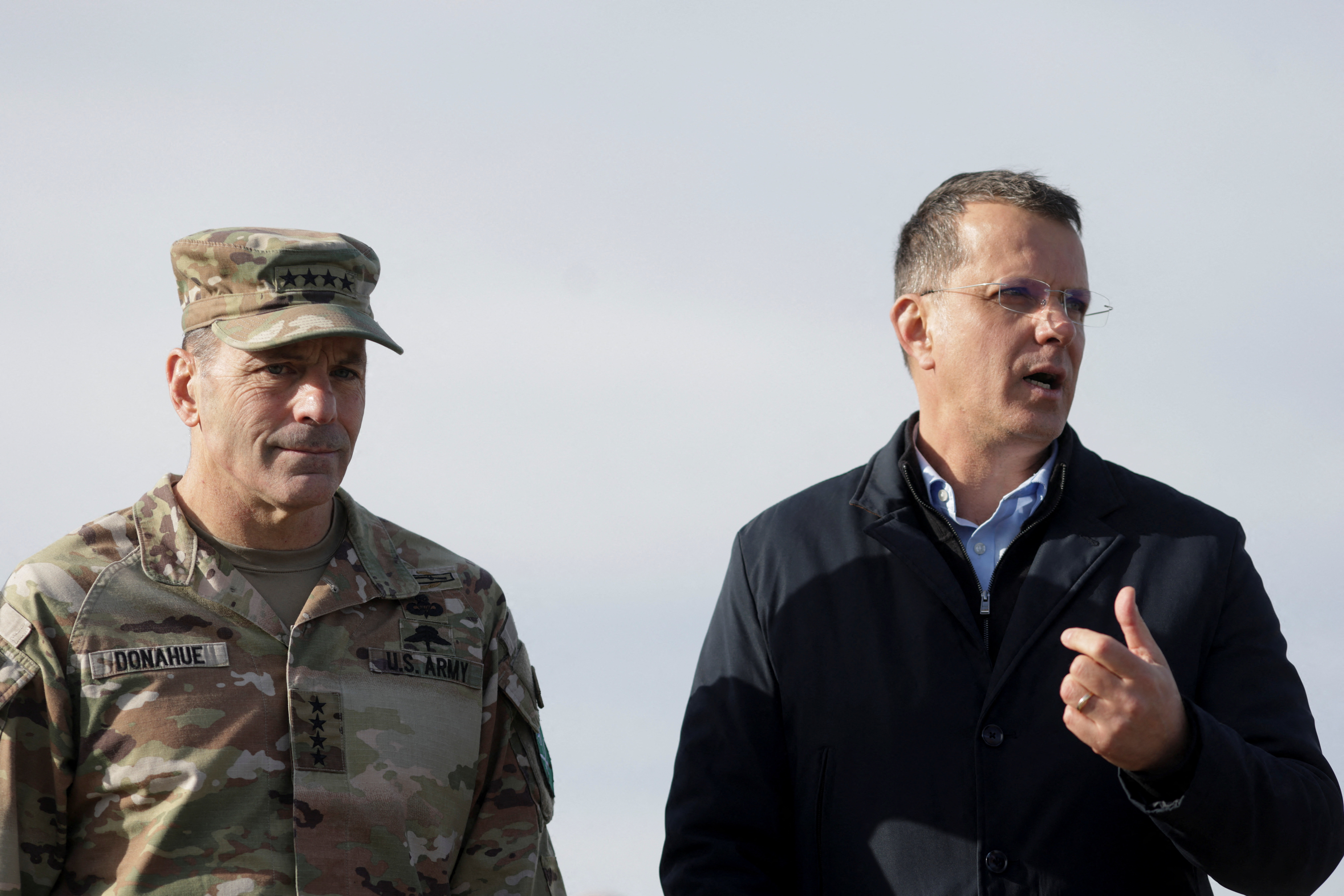 Romanian Minister of Defence Ionut Mosteanu and U.S. Army Europe and Africa Commanding General, Gen. Christopher Donahue, chat with media representatives during a visit at MK Airbase, in Mihail Kogalniceanu