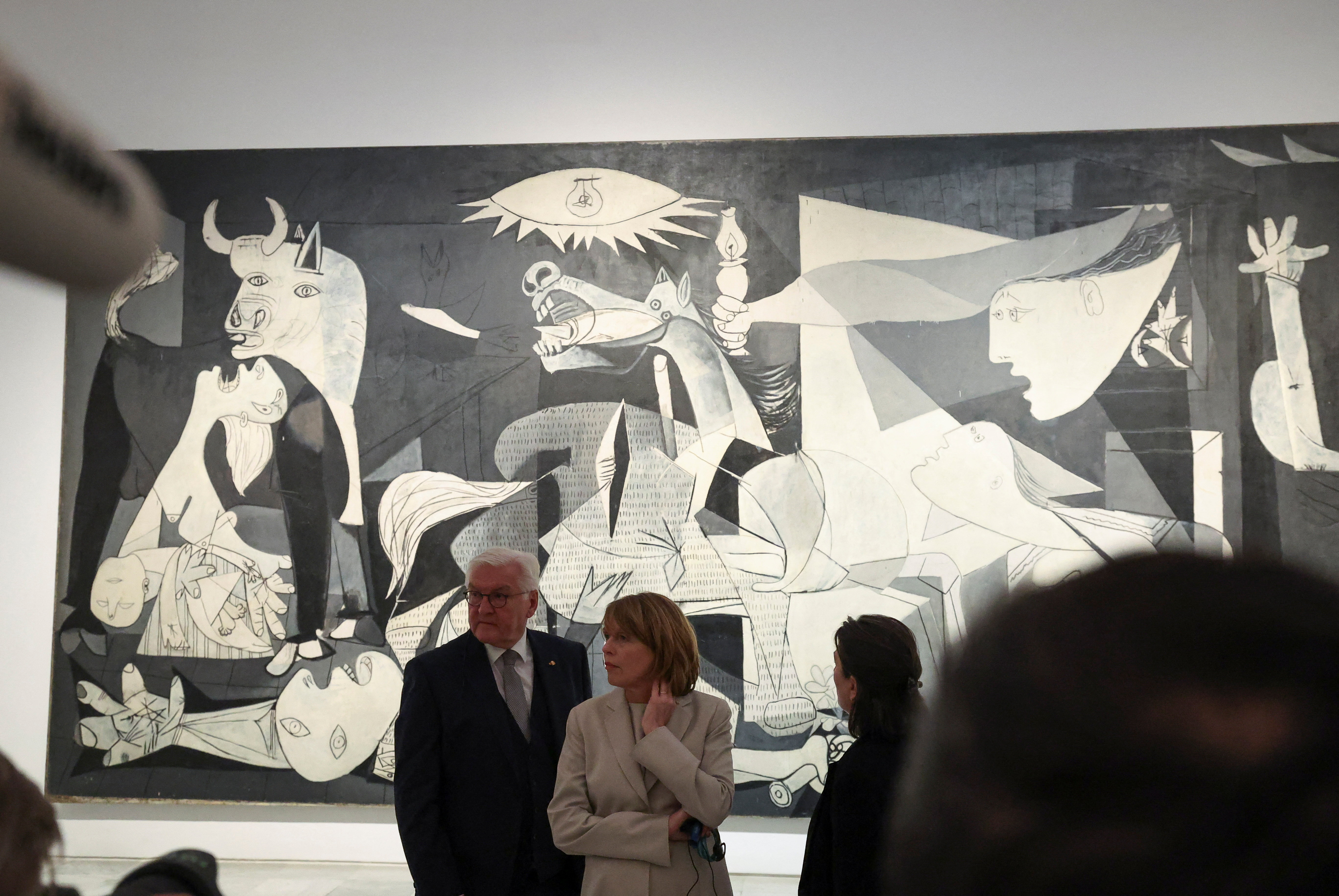 German President Frank-Walter Steinmeier and first lady Elke Buedenbender stand in front of Pablo Picasso's 'Guernica' during a visit to the Reina Sofia museum, in Madrid, Spain, November 26, 2025.