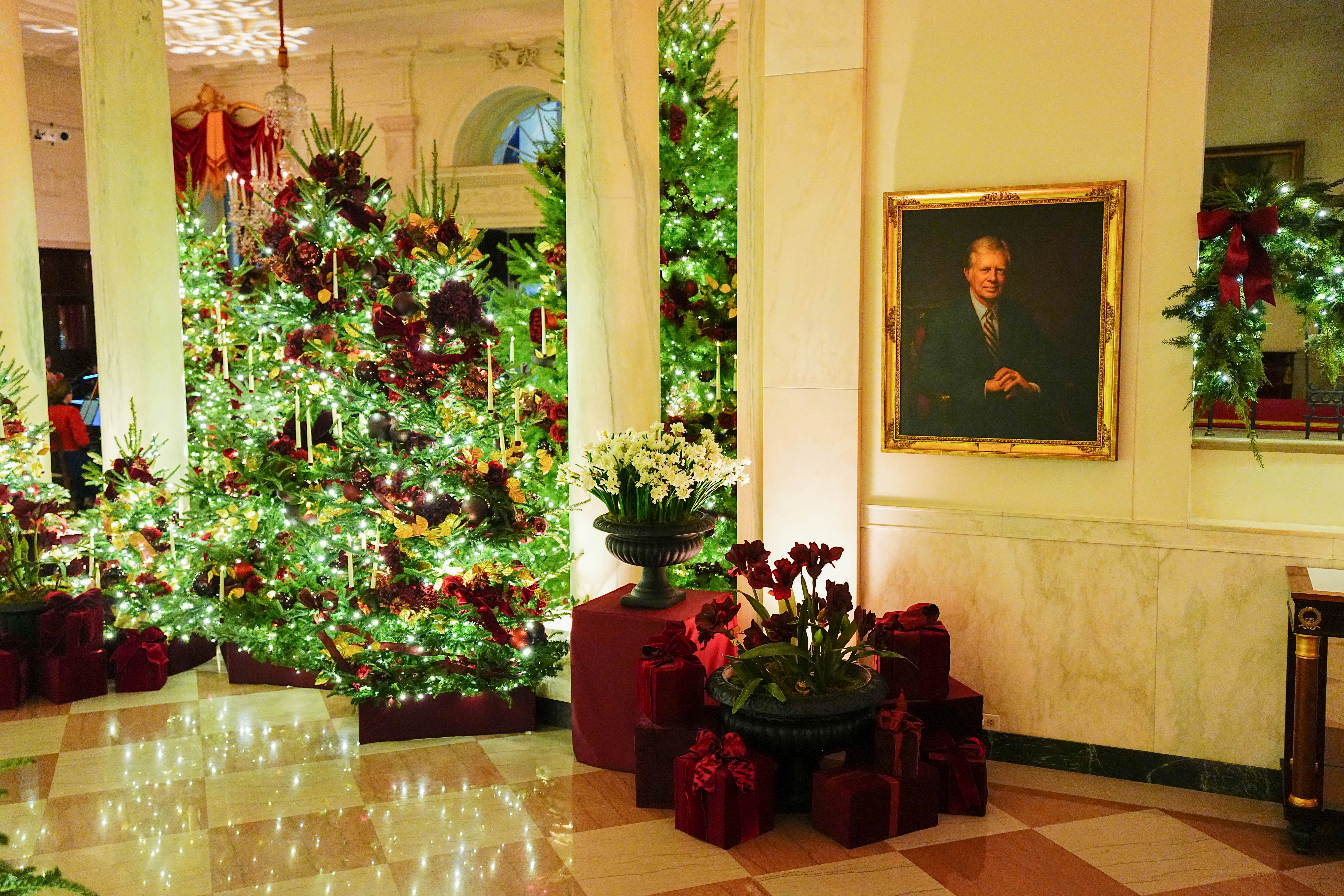 Christmas trees in the Grand Foyer of the White House during a media preview of the 2025 holiday decorations at the White House in Washington, U.S., December 1, 2025. REUTERS/Aaron Schwartz