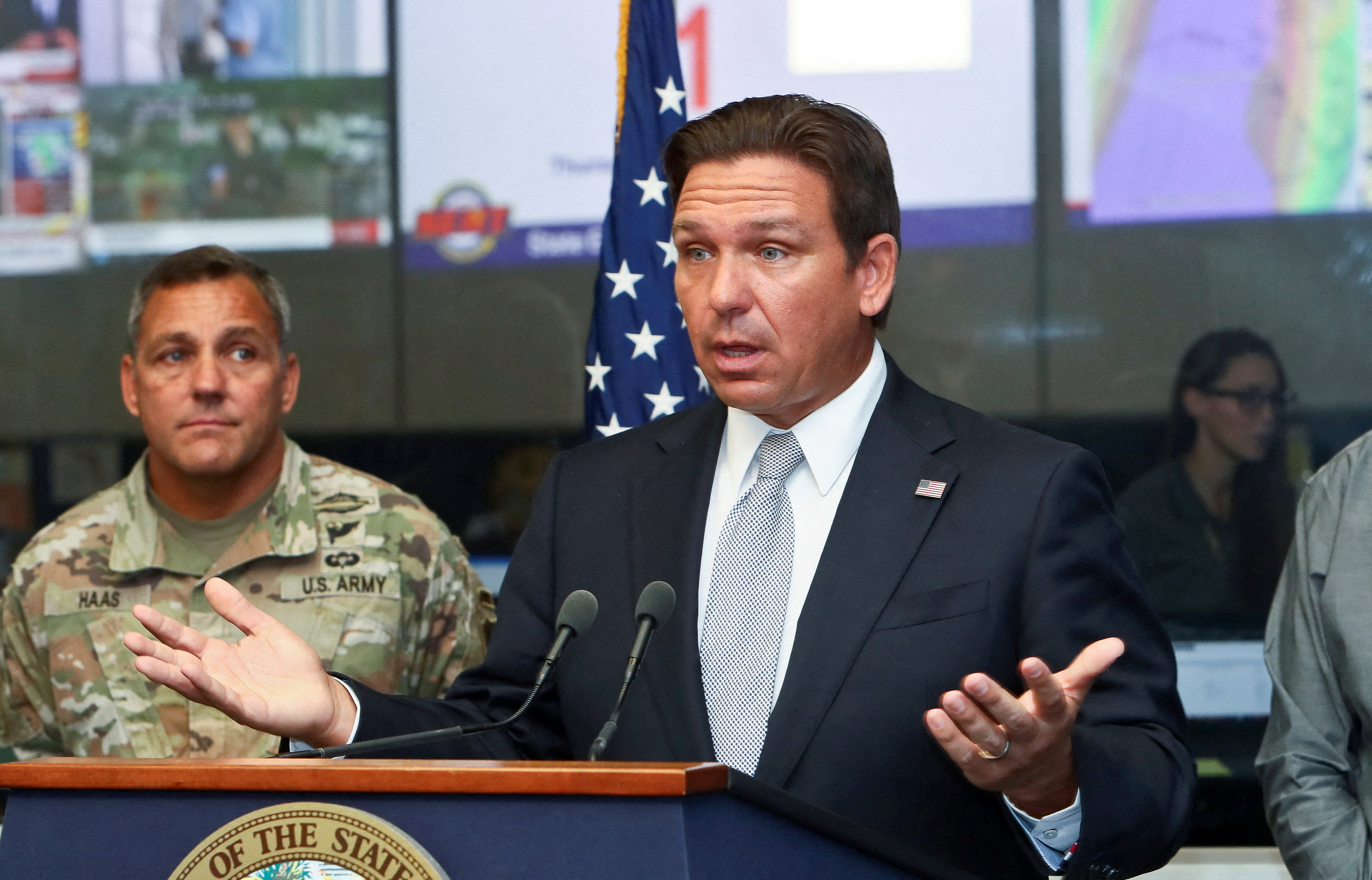 Florida Governor Ron DeSantis speaks about Hurricane Helene as Adjutant General of Florida Major General John Haas looks on during a press briefing at the Emergency Operations Center in Tallahassee, Florida