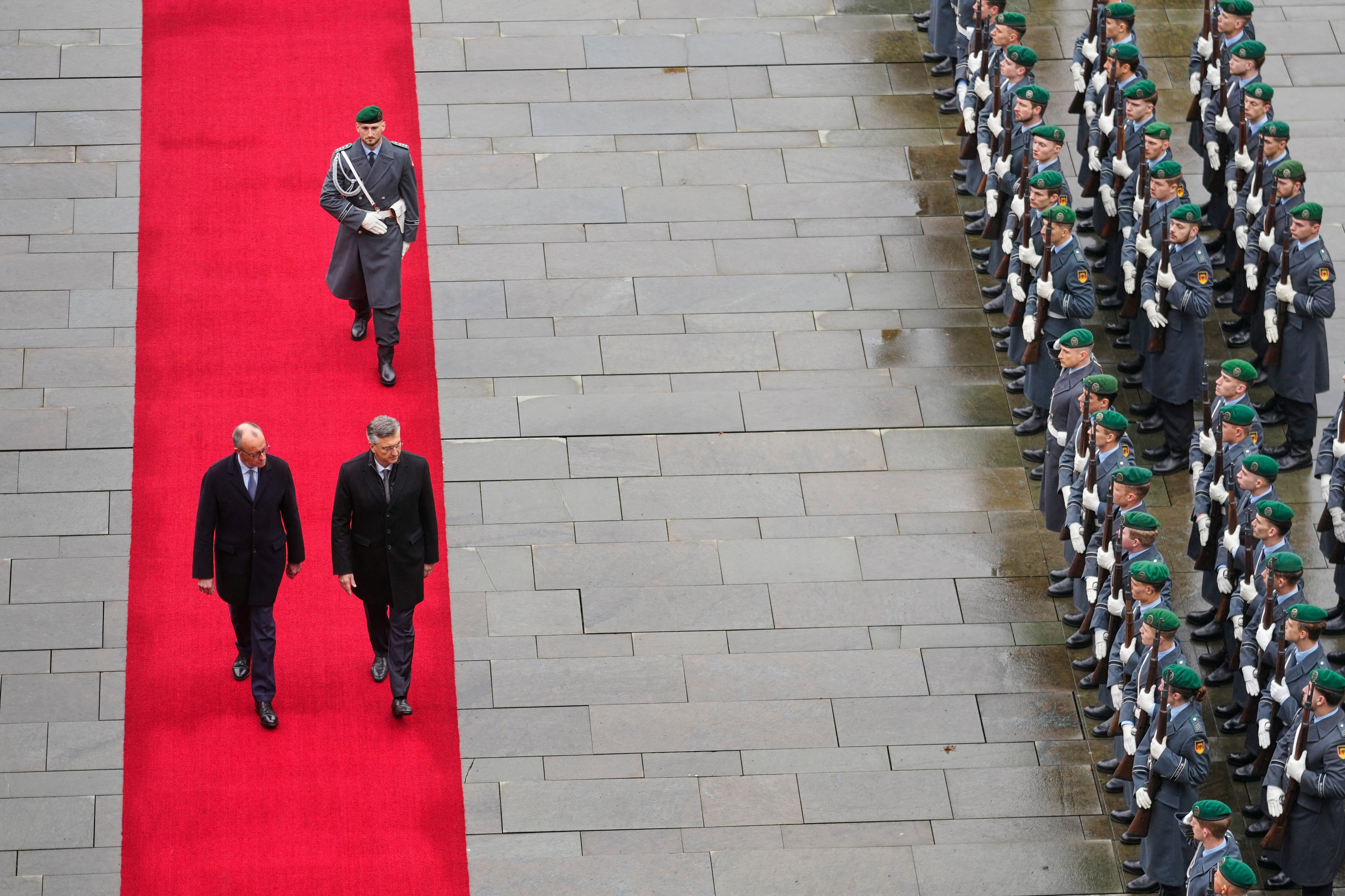 German Chancellor Friedrich Merz welcomes Croatia's Prime Minister Andrej Plenkovic for a meeting at the Chancellery in Berlin, Germany December 10, 2025.     Markus Schreiber/Pool via REUTERS