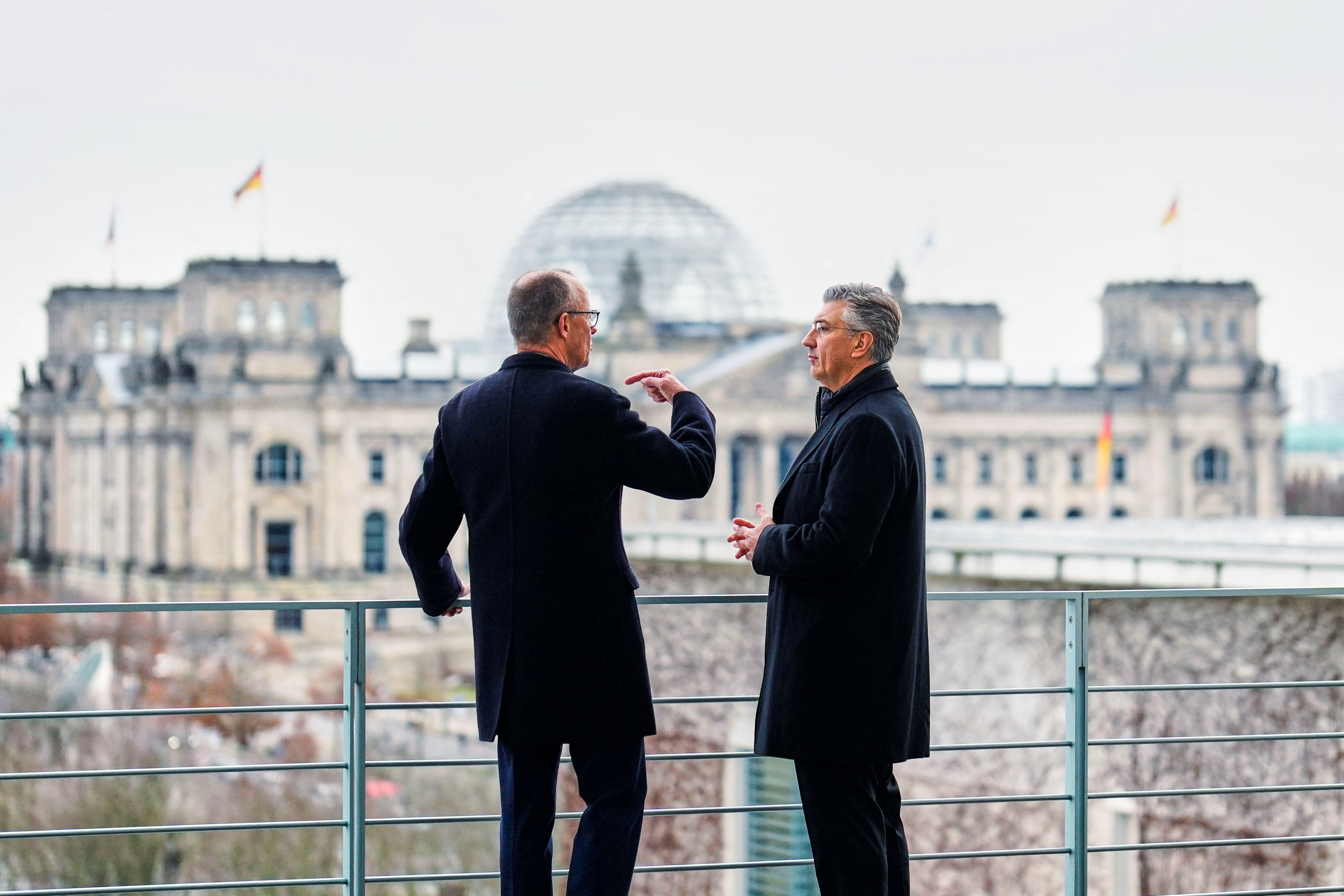 German Chancellor Friedrich Merz speaks with Croatia's Prime Minister Andrej Plenkovic during their meeting at the Chancellery in Berlin, Germany December 10, 2025.     Markus Schreiber/Pool via REUTERS