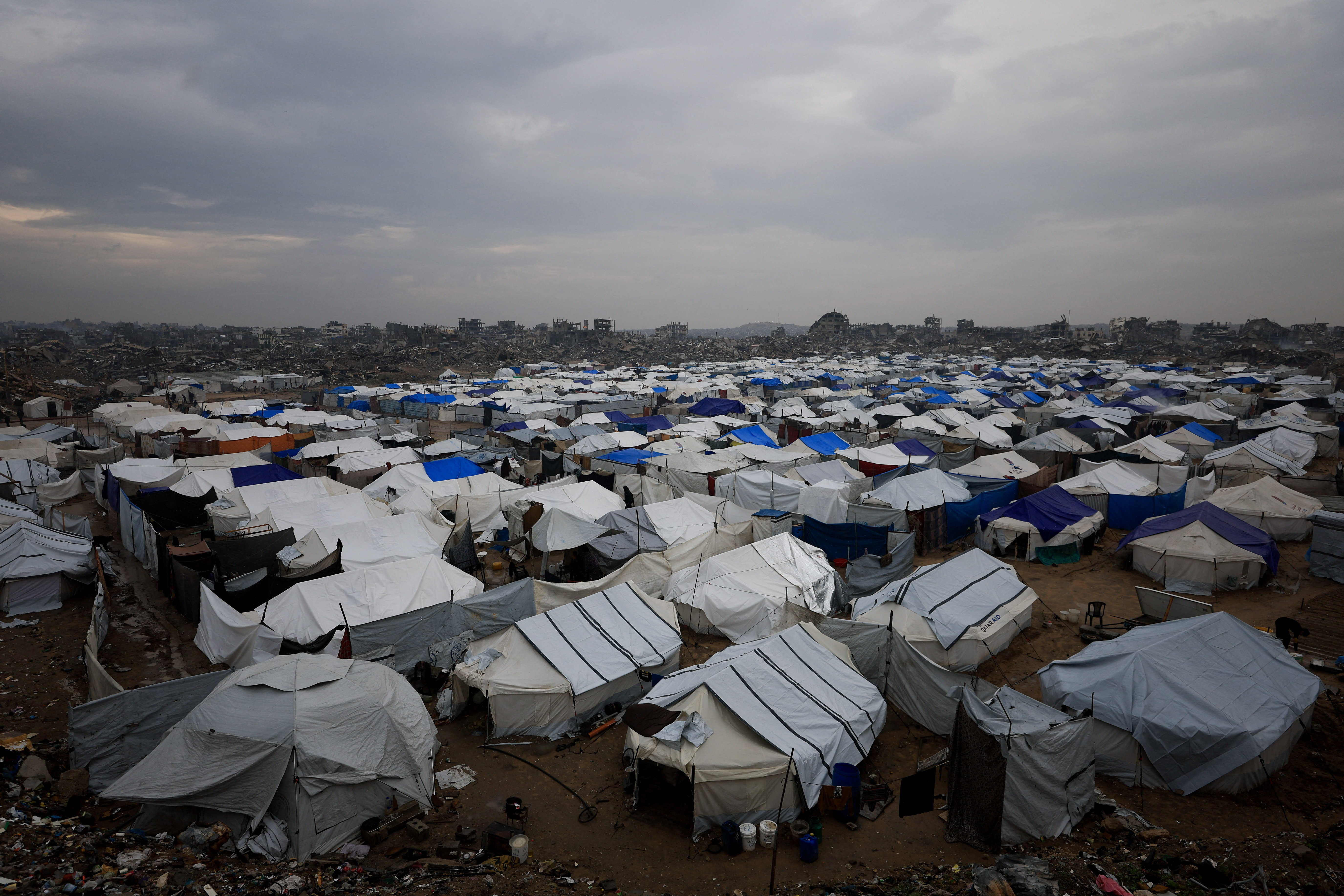 Displaced Palestinians shelter in a tent camp on a rainy day in Gaza City, December 11, 2025. REUTERS/Dawoud Abu Alkas