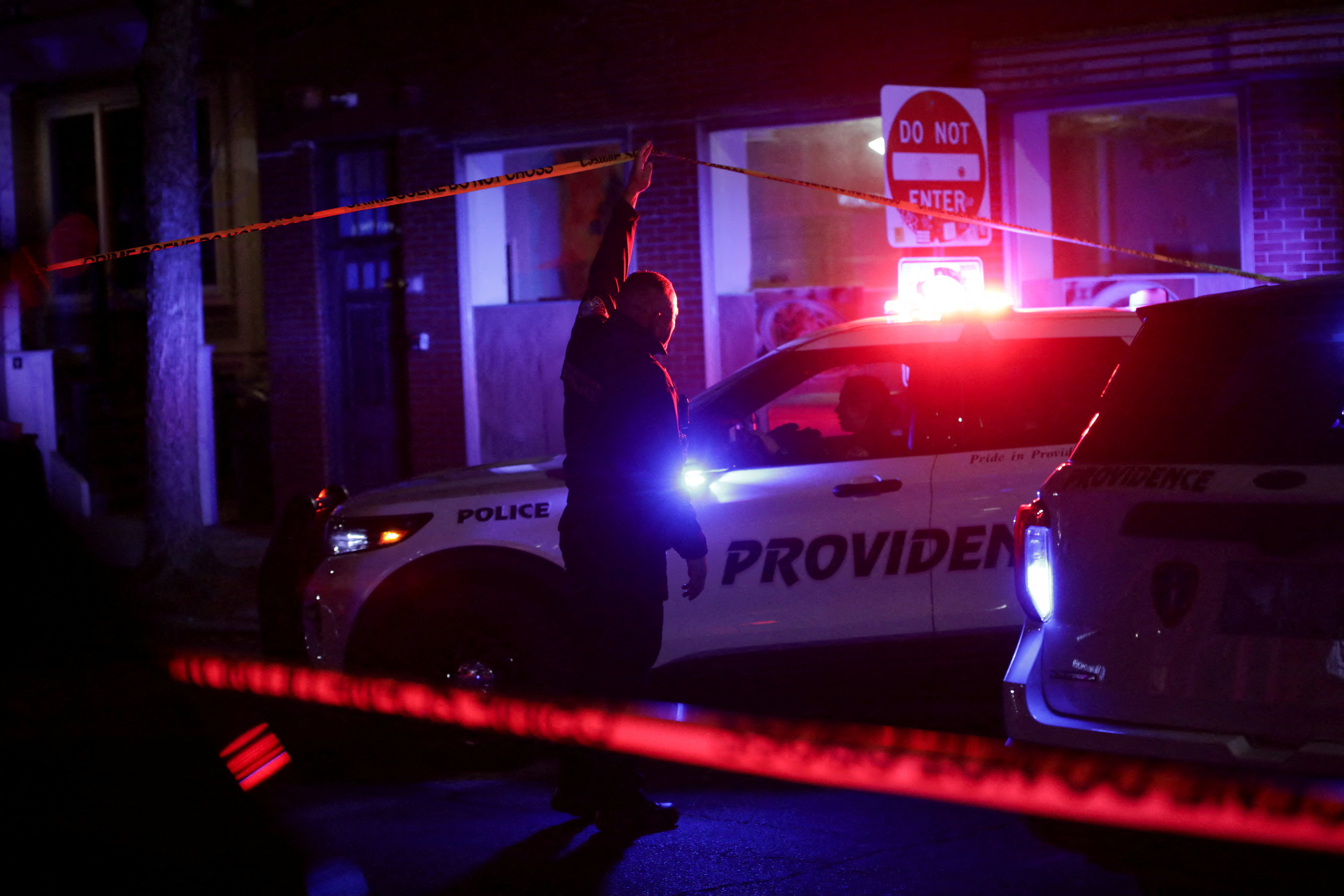 Law enforcement officers canvas the area after Brown University was locked down amid reports of a shooting on campus in Providence, Rhode Island, U.S. December 13, 2025.  REUTERS/Taylor Coester     TPX IMAGES OF THE DAY
