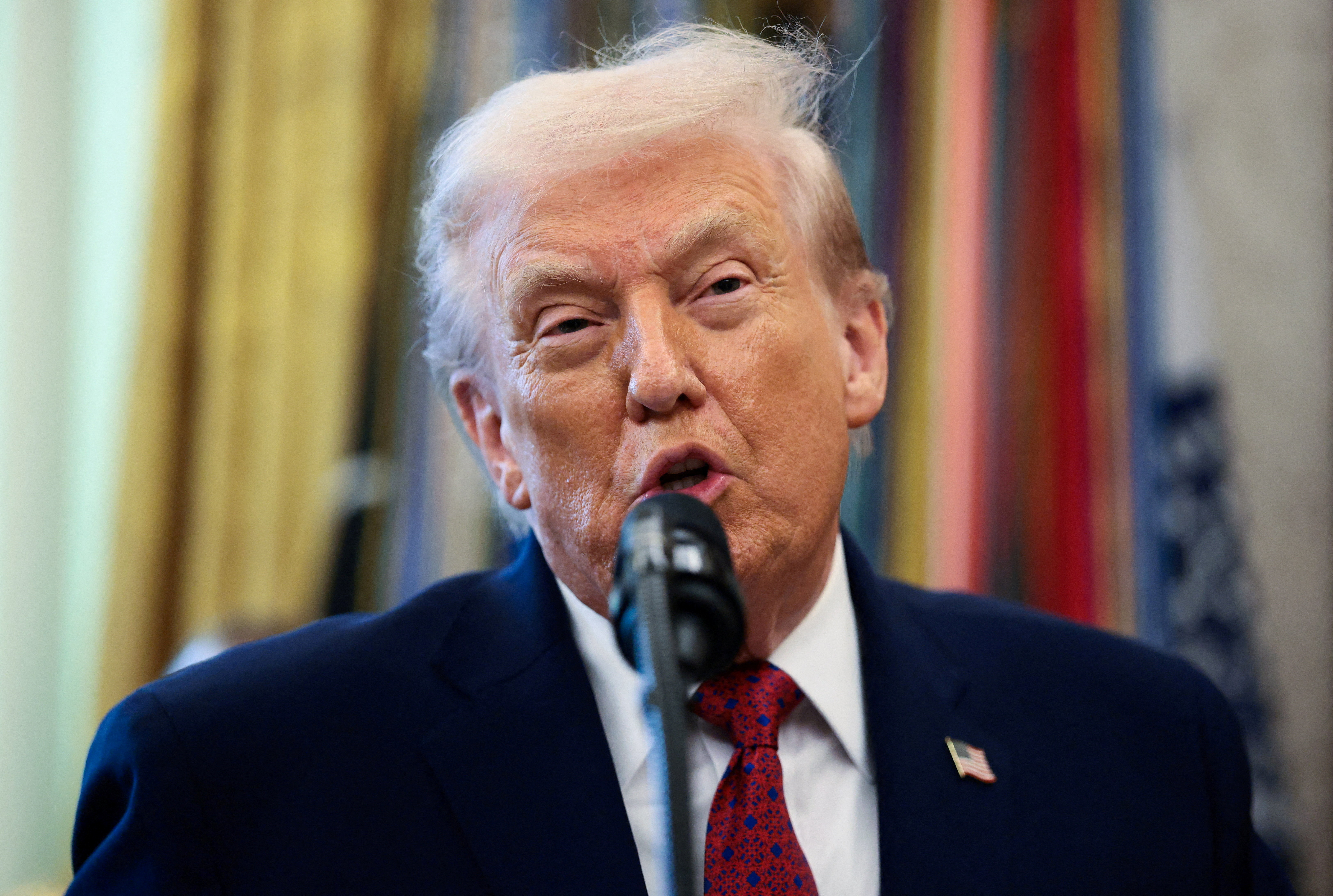 U.S. President Donald Trump speaks during a Mexican Border Defense Medal presentation in the Oval Office at the White House in Washington, D.C., U.S., December 15, 2025. REUTERS/Evelyn Hockstein