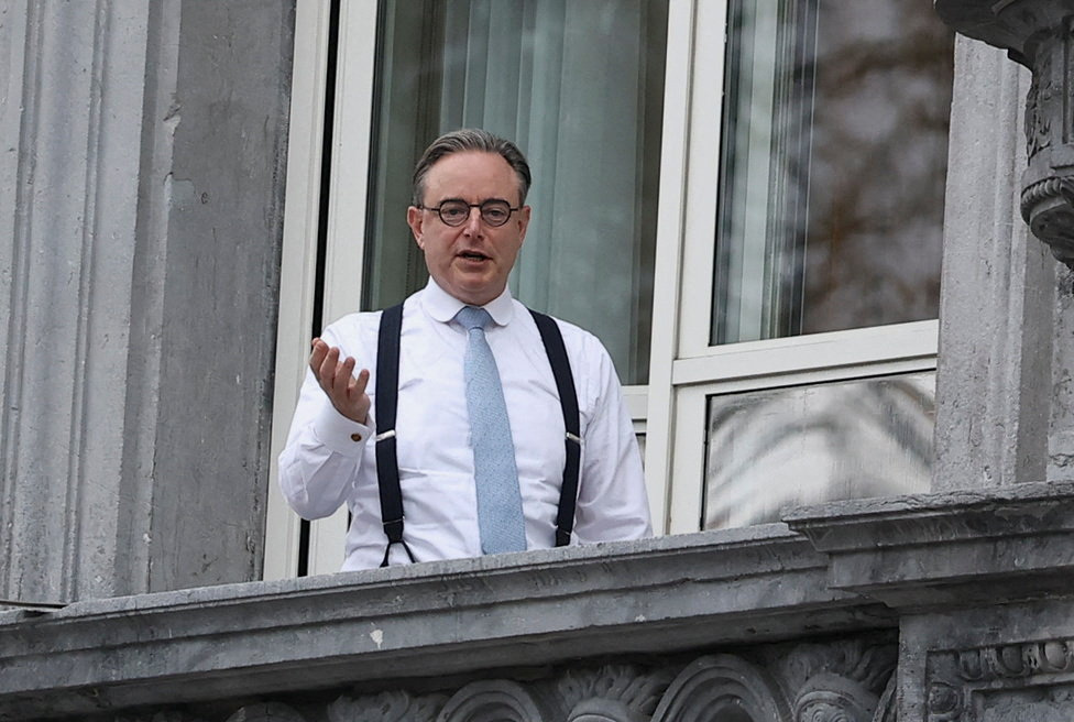 Belgium's Prime Minister Bart de Wever appears on the balcony of his office on the eve of the European Union leaders' summit, in Brussels, Belgium, December 17, 2025. REUTERS/Yves Herman
