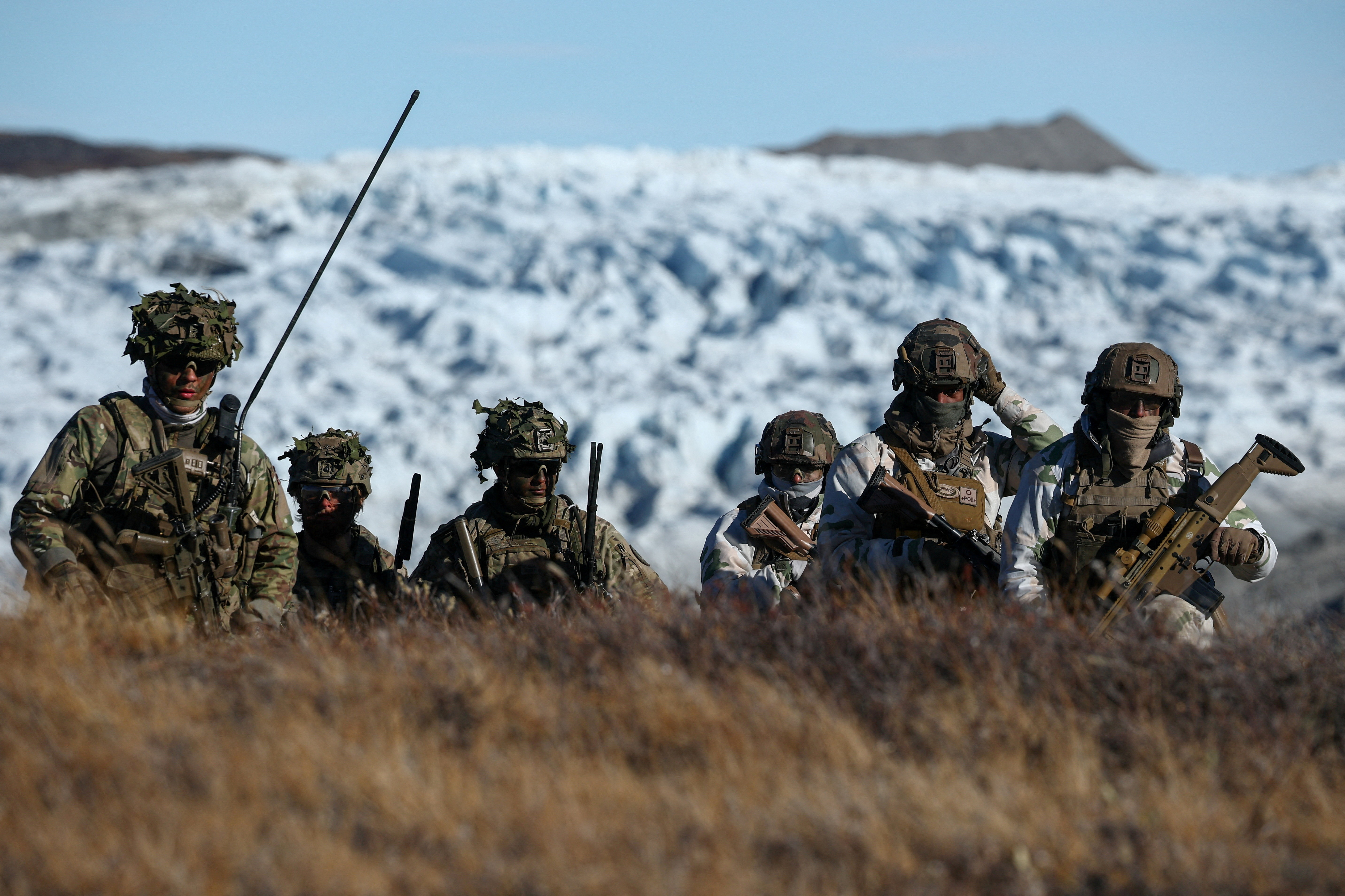 Members of the Danish armed forces practice looking for potential threats during a military drill as Danish, Swedish and Norwegian home guard units together with Danish, German and French troops take part in joint military drills