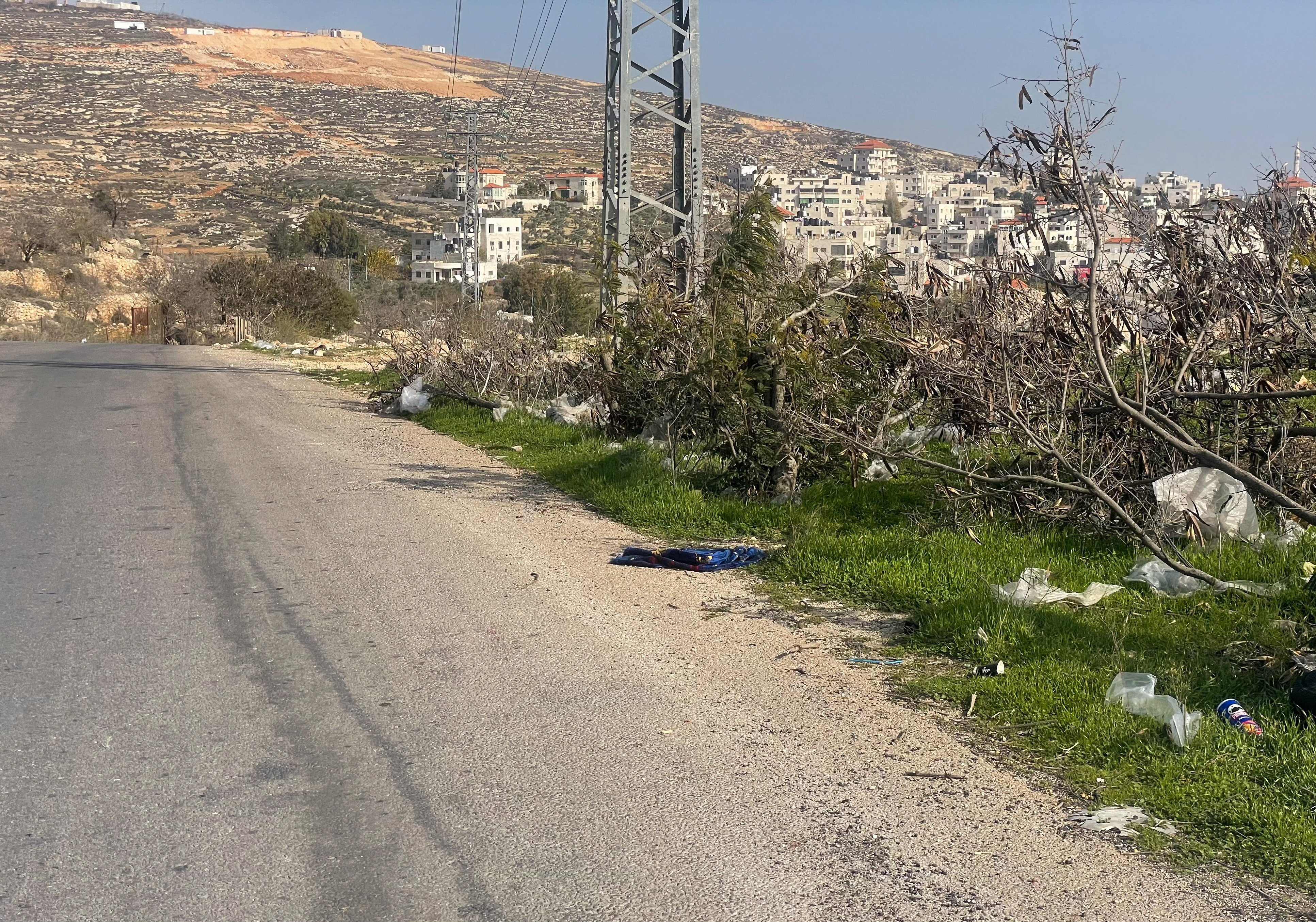 A prayer mat lies on the ground near the scene where an Israeli reservist rammed his vehicle into Palestinian Majdi Abu Mukho as he was praying, near Deir Jareer in the Israeli-occupied West Bank,
