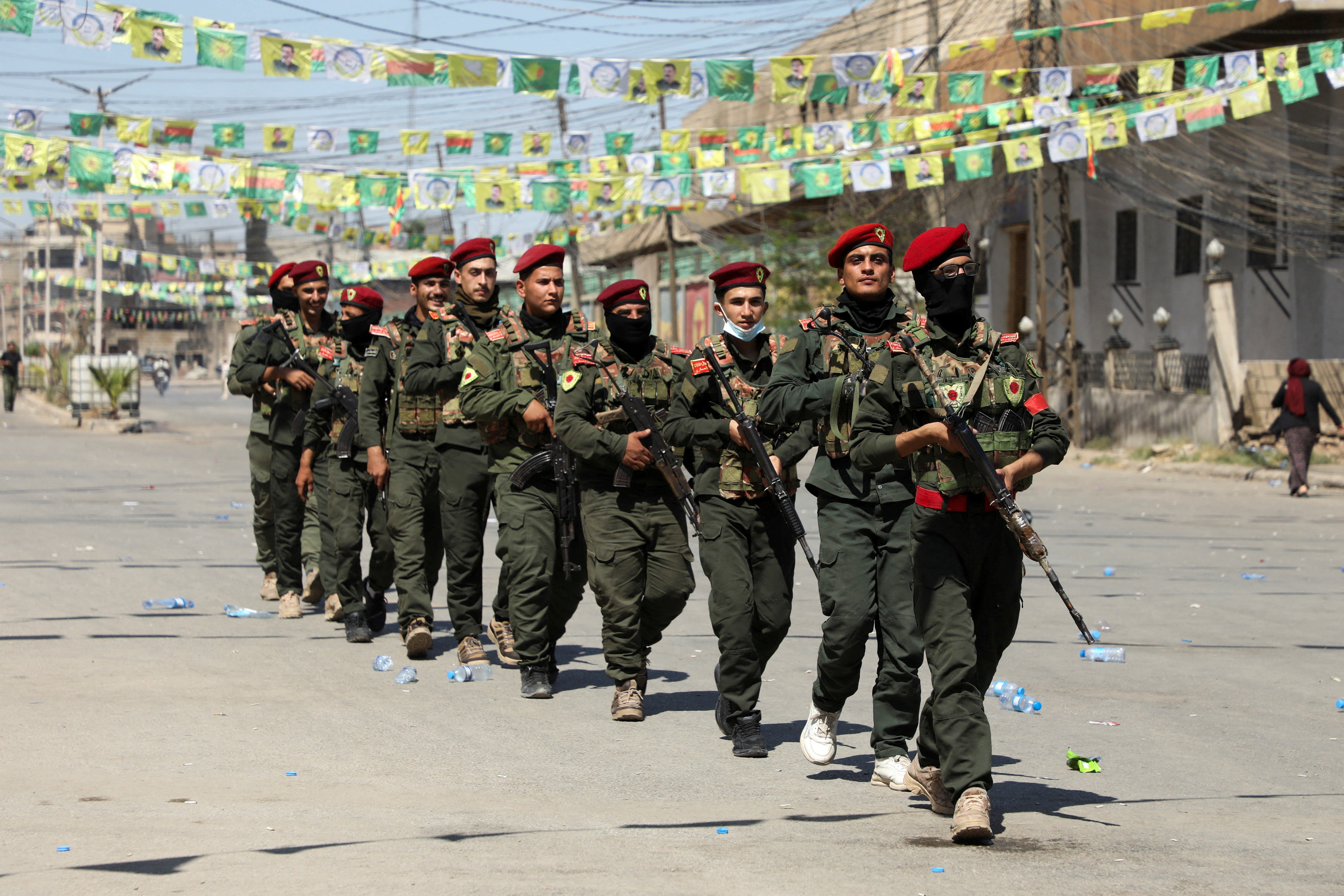 Armed members of the Syrian Democratic Forces' (SDF) military police take part in a demonstration under the banner “With our will, we will protect our revolution”, in Qamishli, Syria, September 17, 2025.